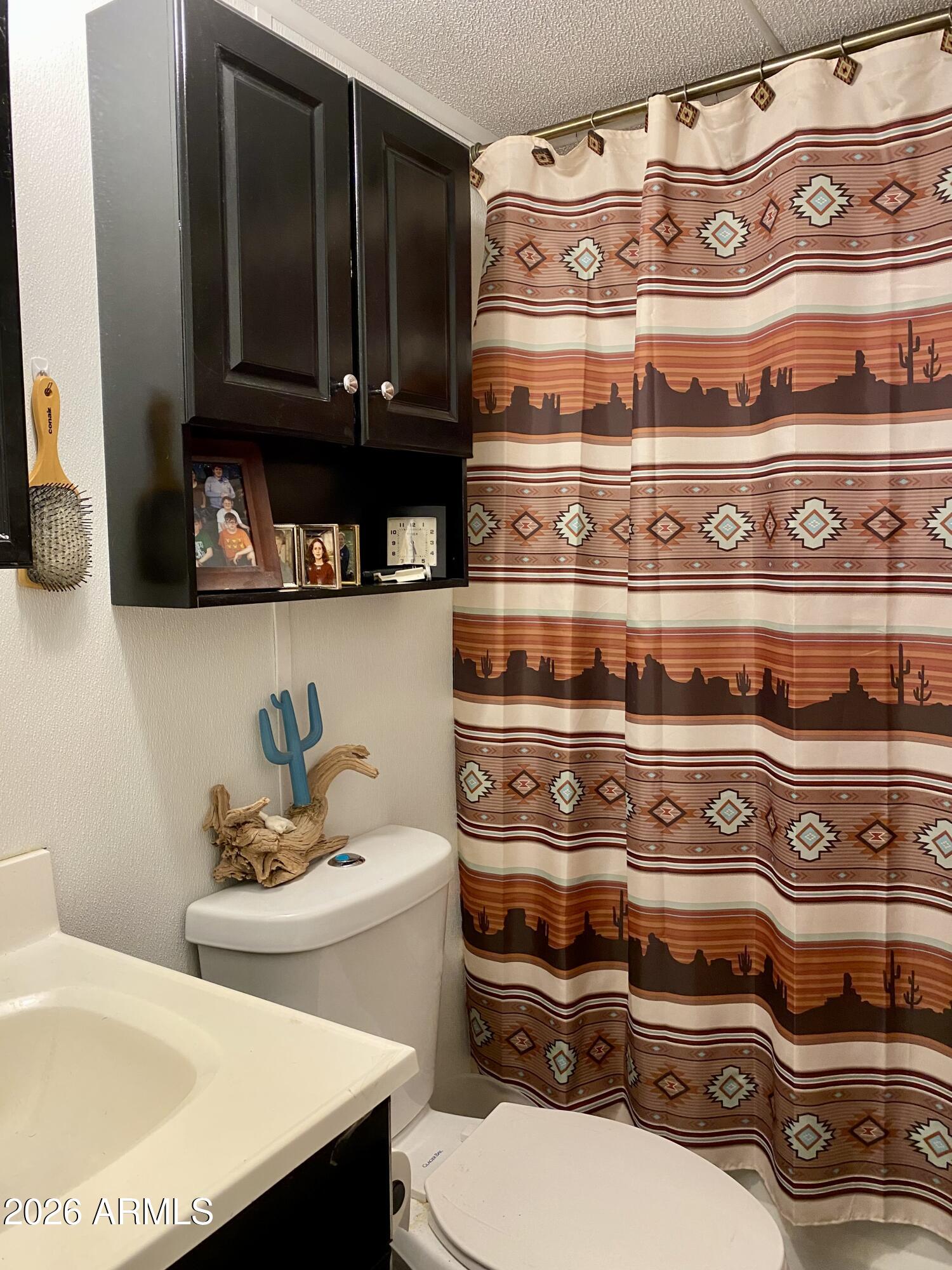 723 Finnie Flat Road, Unit 103 Camp Verde, AZ 86322 - Photo 24 of 41 a bathroom with a sink and a stove