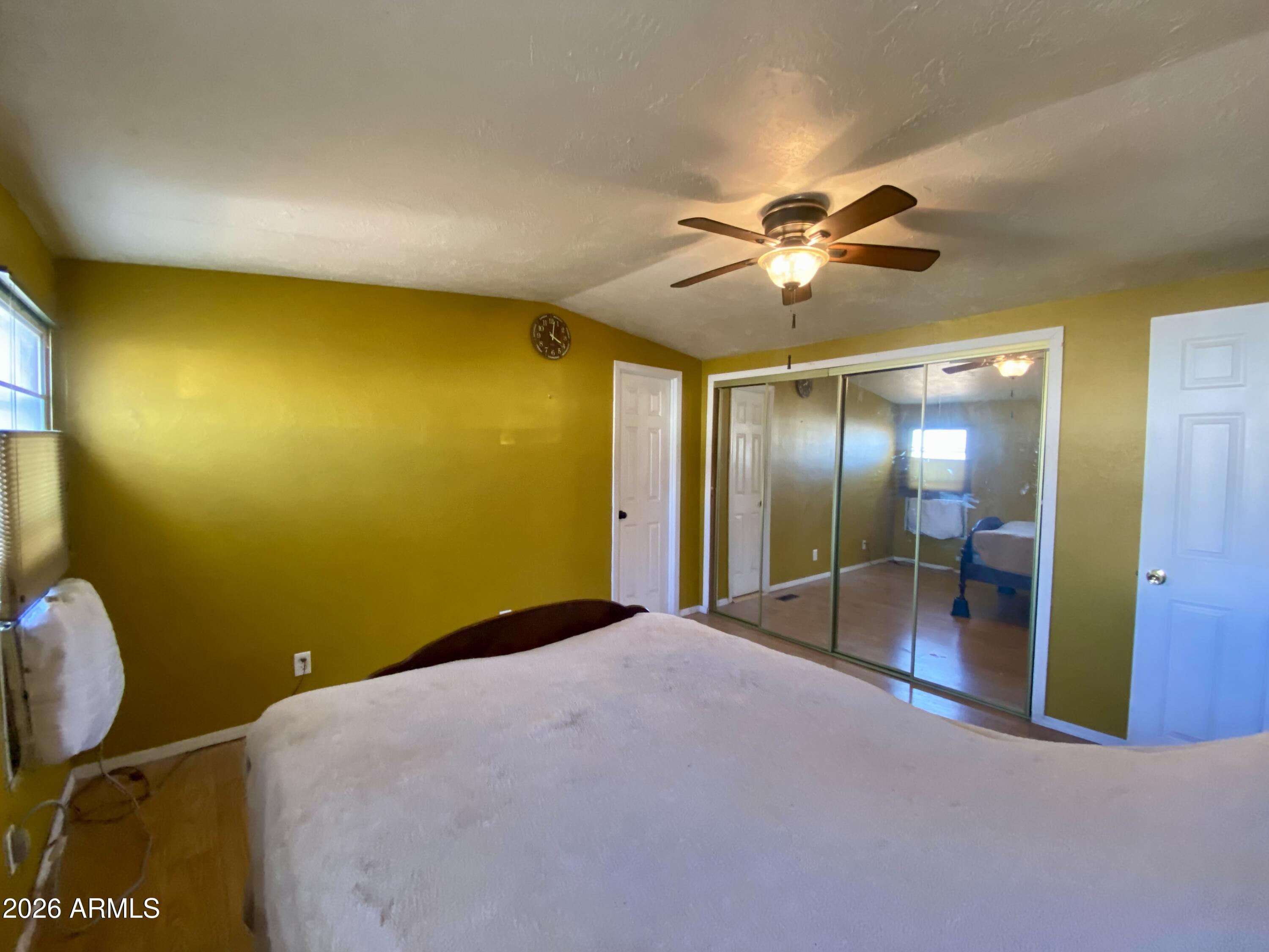 723 Finnie Flat Road, Unit 103 Camp Verde, AZ 86322 - Photo 26 of 41 a view of a livingroom with a chandelier fan and a bathroom
