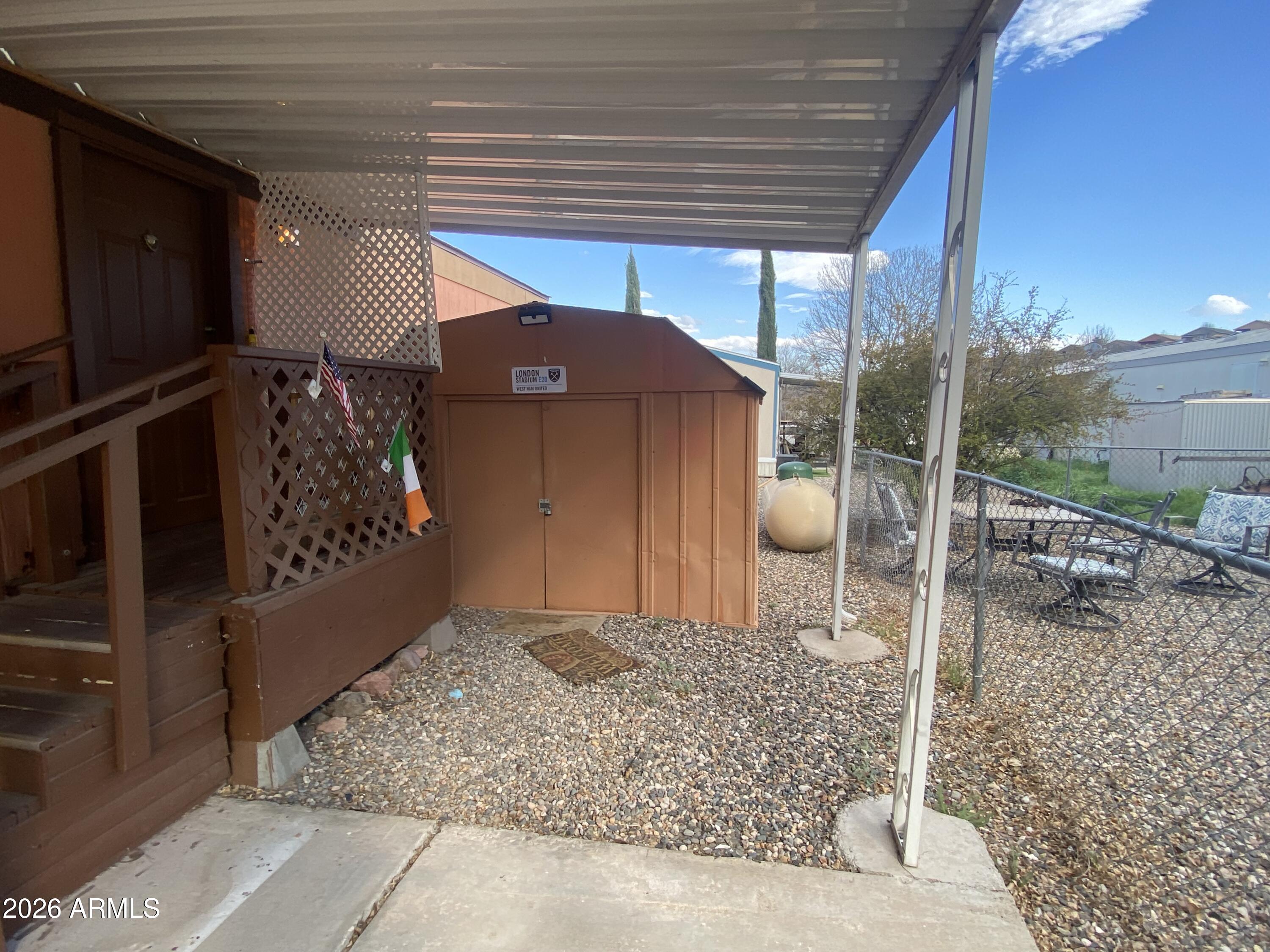 723 Finnie Flat Road, Unit 103 Camp Verde, AZ 86322 - Photo 3 of 41 a view of a house with a sink and glass door