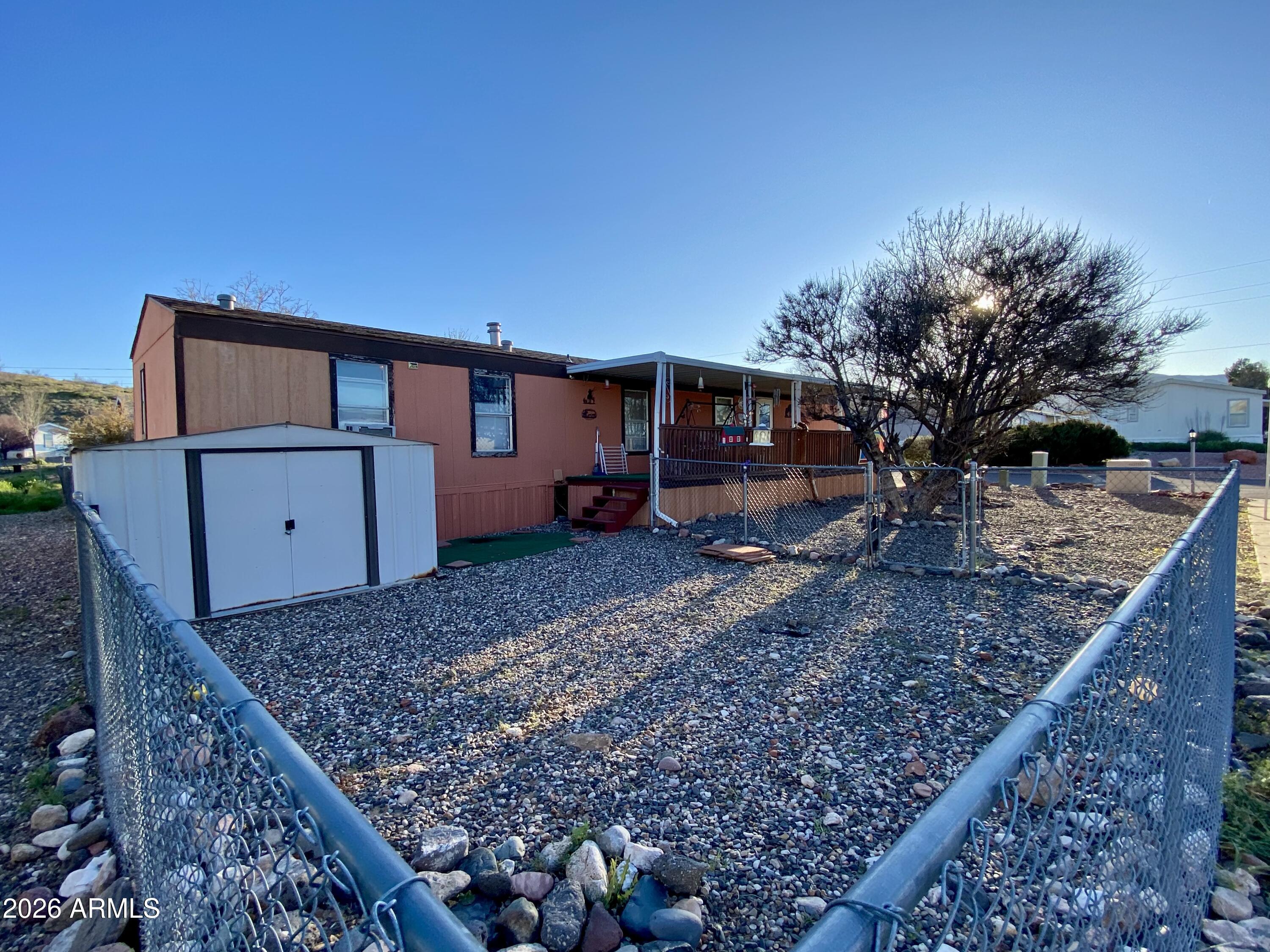 723 Finnie Flat Road, Unit 103 Camp Verde, AZ 86322 - Photo 32 of 41 a view of a backyard with a barn