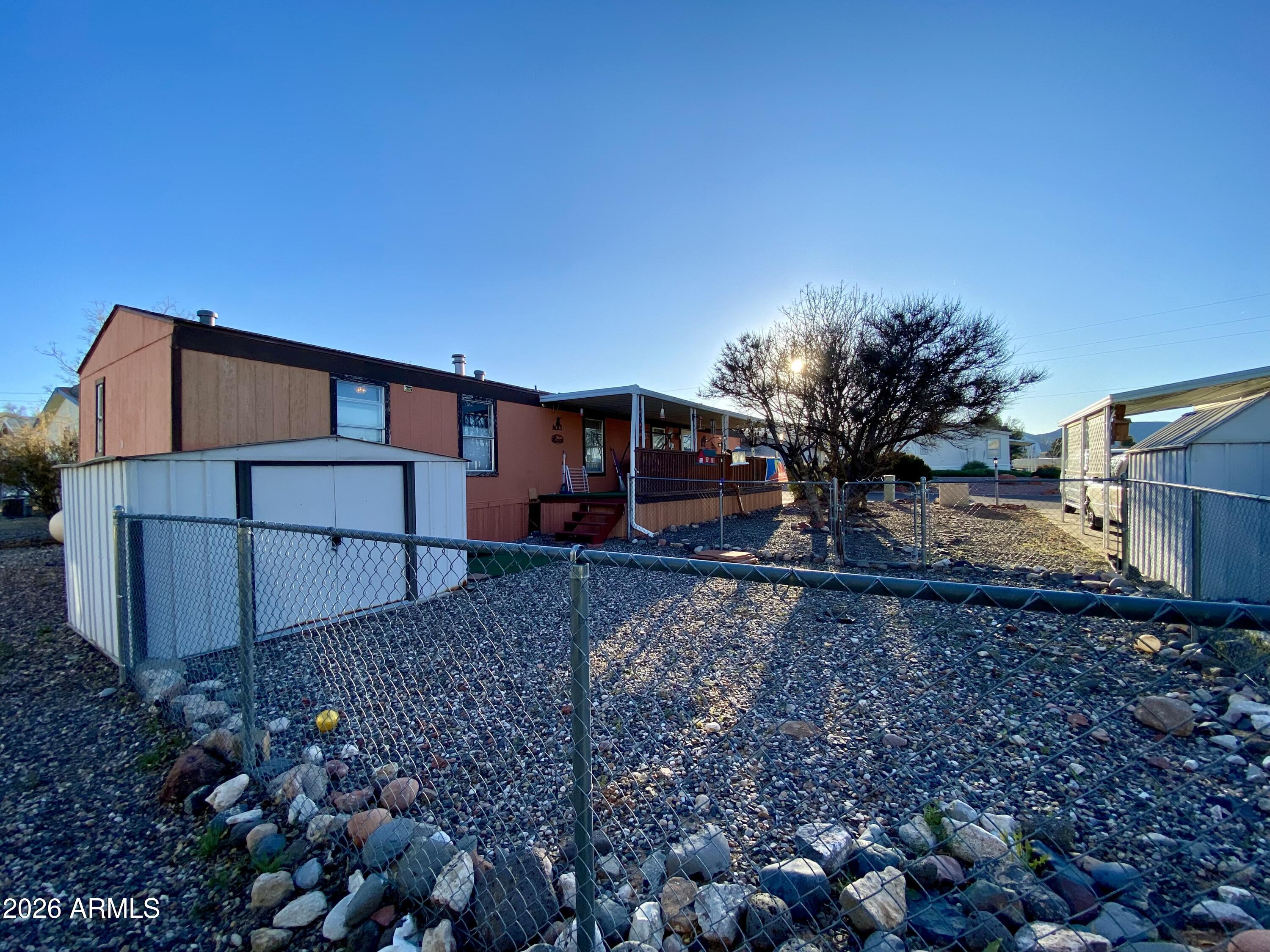 723 Finnie Flat Road, Unit 103 Camp Verde, AZ 86322 - Photo 33 of 41 a backyard of a house with lots of green space
