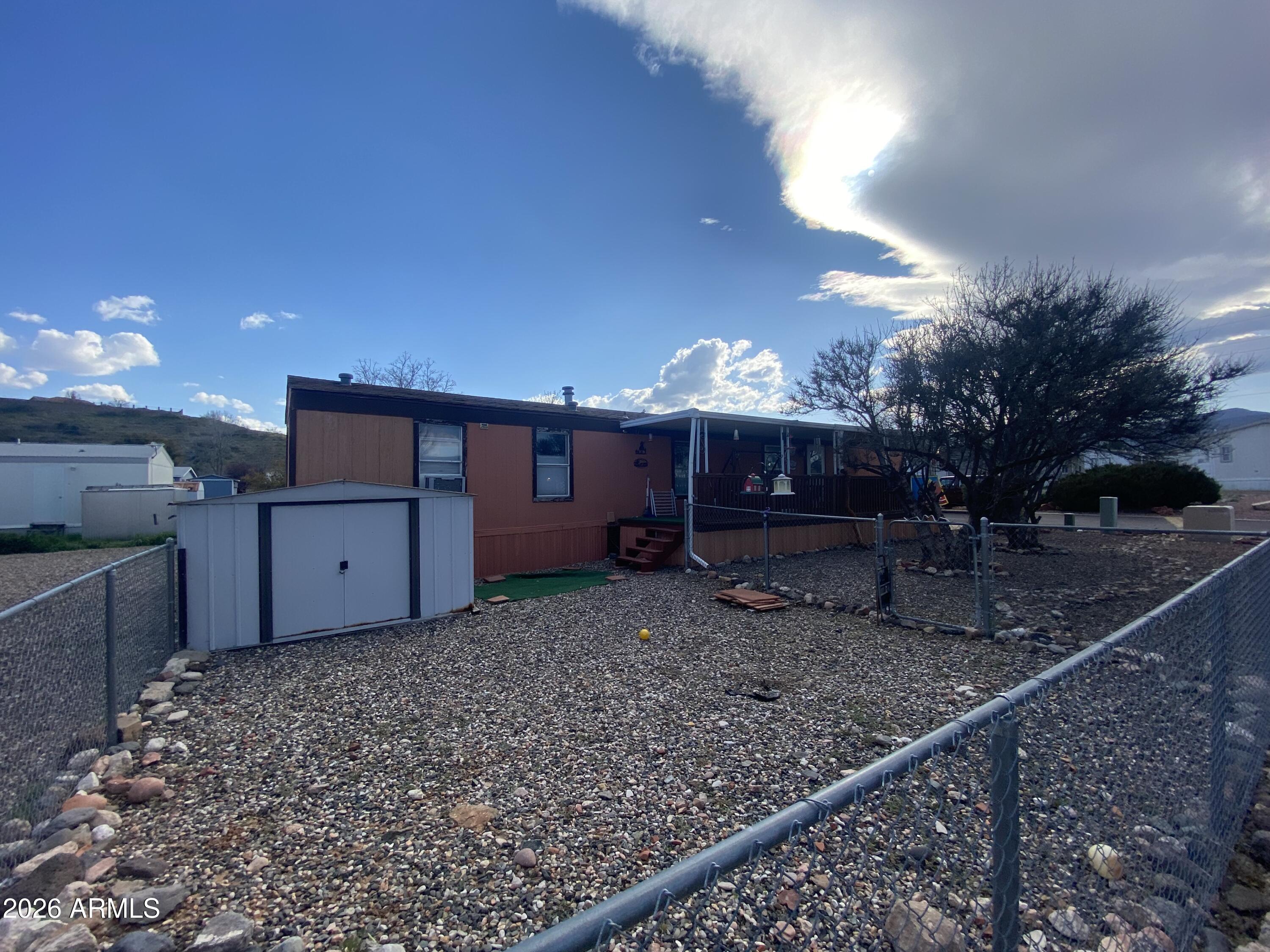 723 Finnie Flat Road, Unit 103 Camp Verde, AZ 86322 - Photo 34 of 41 a view of a house with a yard