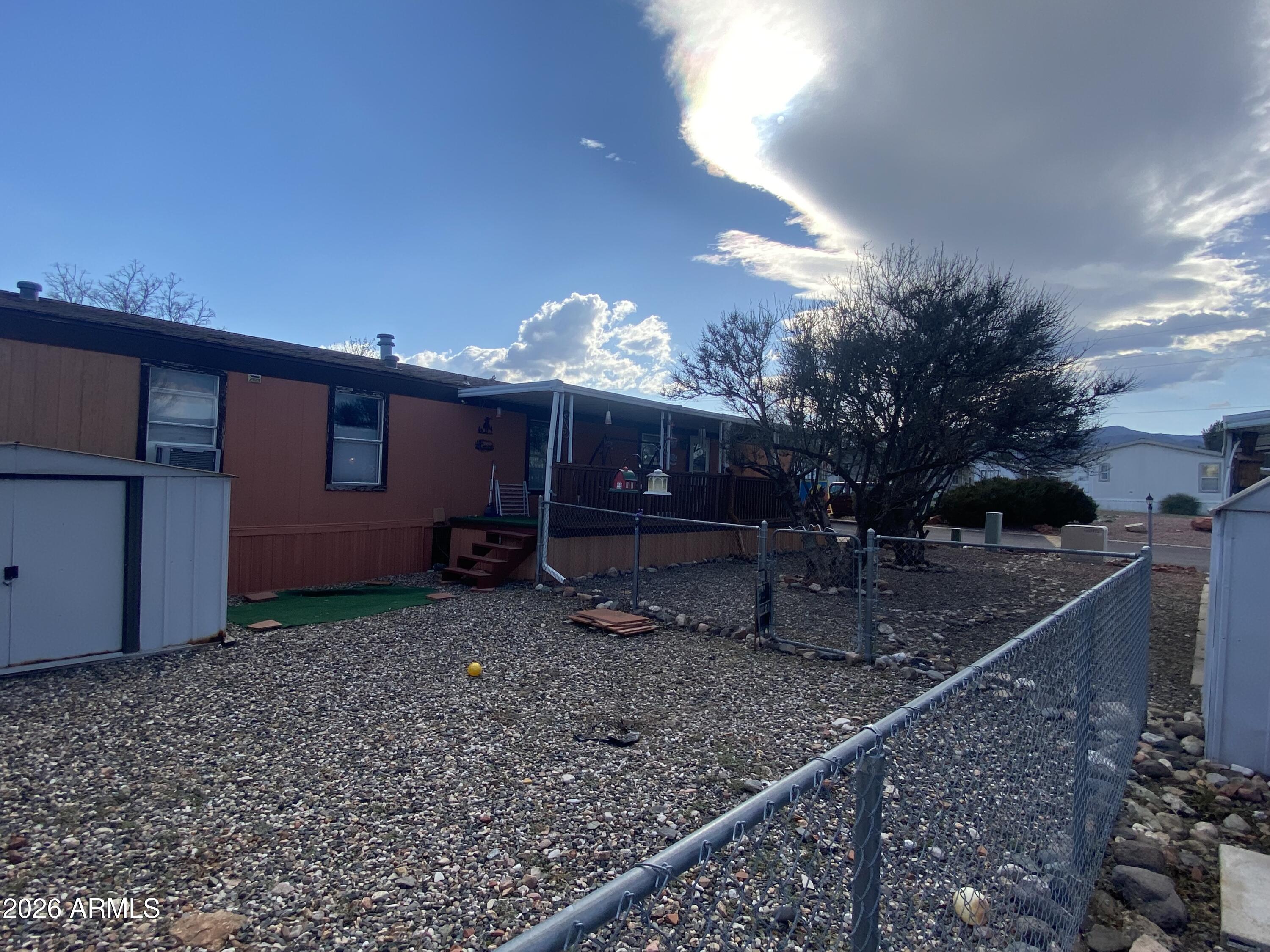 723 Finnie Flat Road, Unit 103 Camp Verde, AZ 86322 - Photo 35 of 41 a view of a house with a backyard