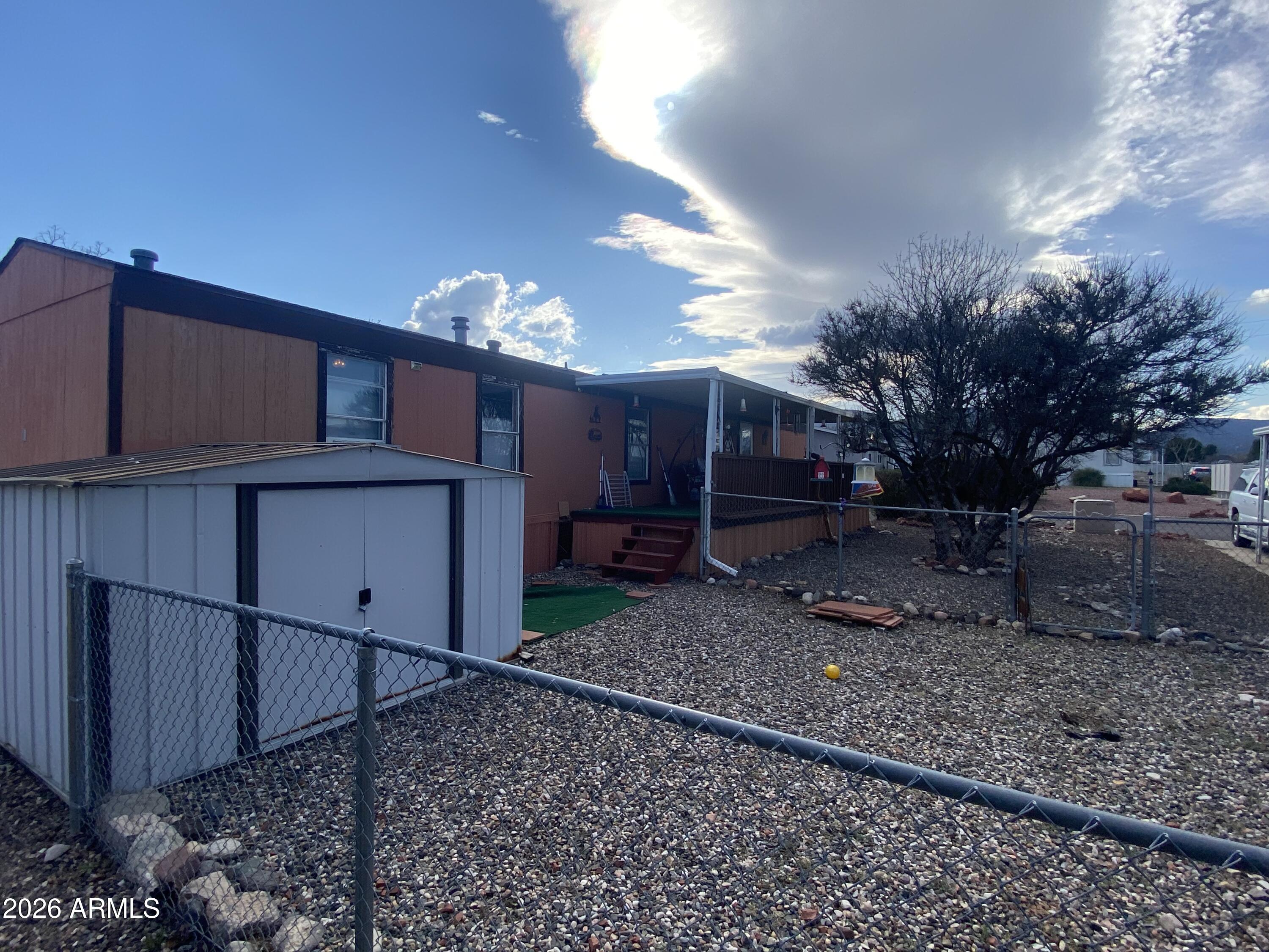 723 Finnie Flat Road, Unit 103 Camp Verde, AZ 86322 - Photo 36 of 41 a view of a house with a yard