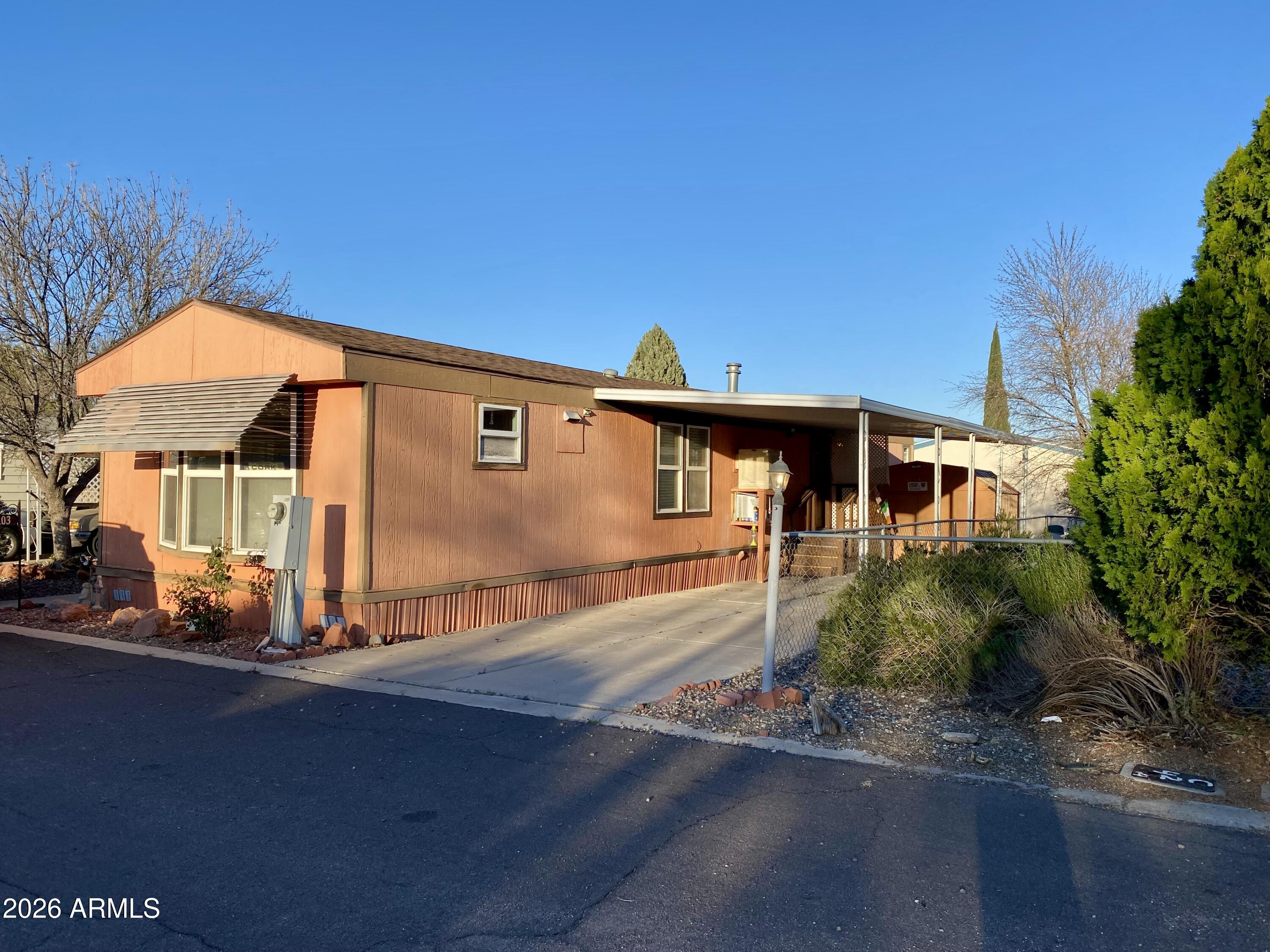 723 Finnie Flat Road, Unit 103 Camp Verde, AZ 86322 - Photo 39 of 41 a front view of a house with a yard