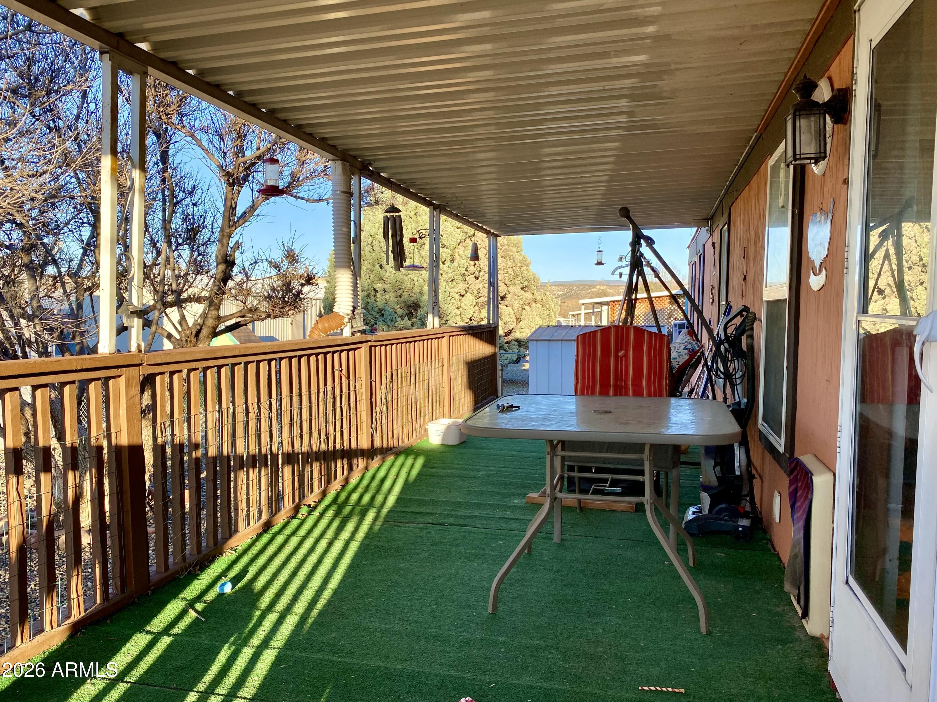723 Finnie Flat Road, Unit 103 Camp Verde, AZ 86322 - Photo 5 of 41 a view of porch with a backyard