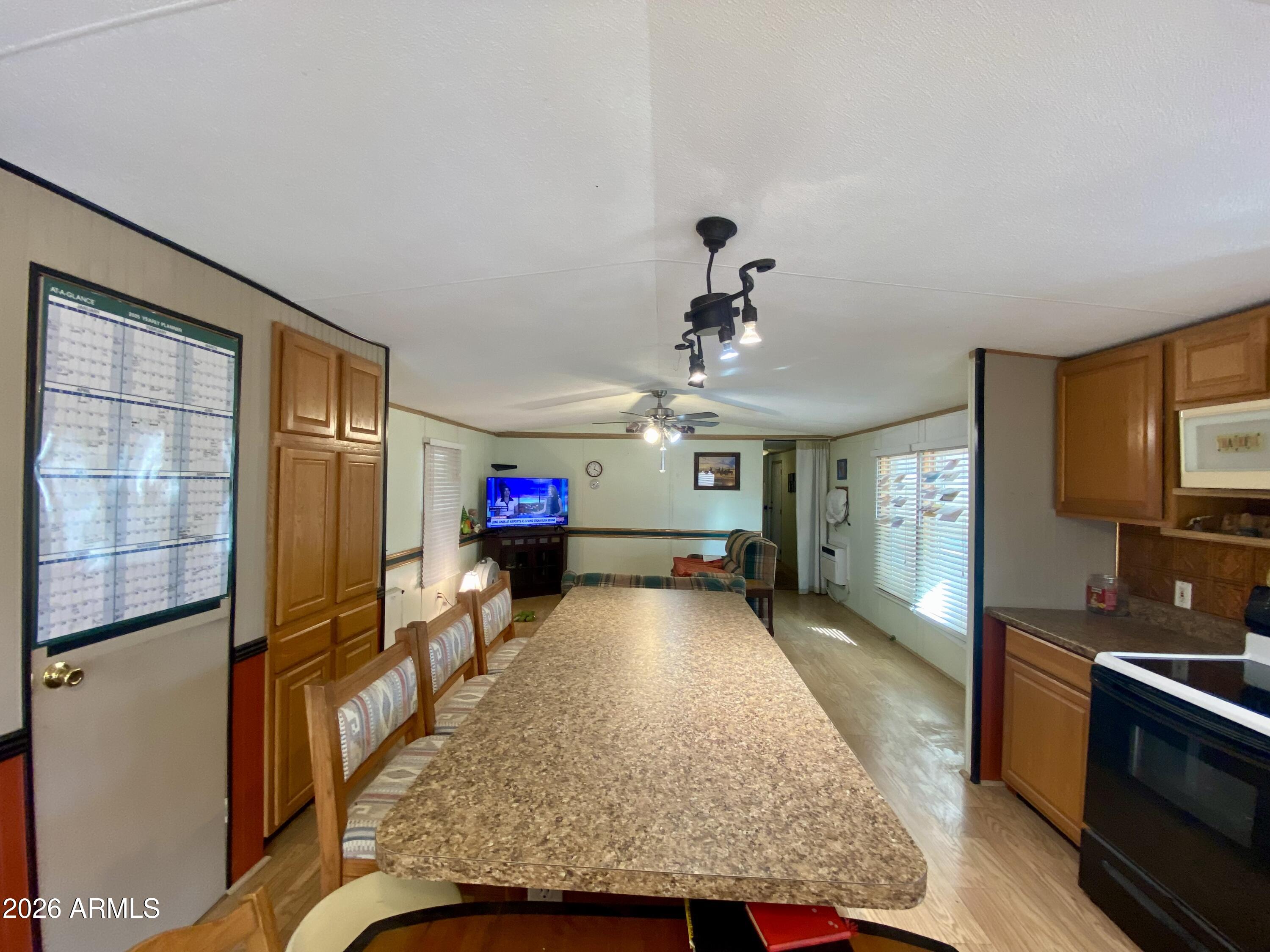 723 Finnie Flat Road, Unit 103 Camp Verde, AZ 86322 - Photo 9 of 41 a living room with furniture and a flat screen tv