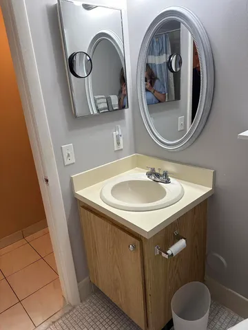 a bathroom with a sink and a mirror