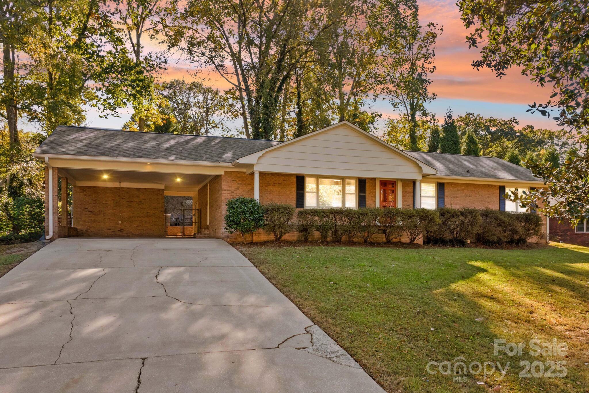 1231 Maxwell Street Salisbury, NC 28144 - Photo 2 of 42 a front view of a house with garden