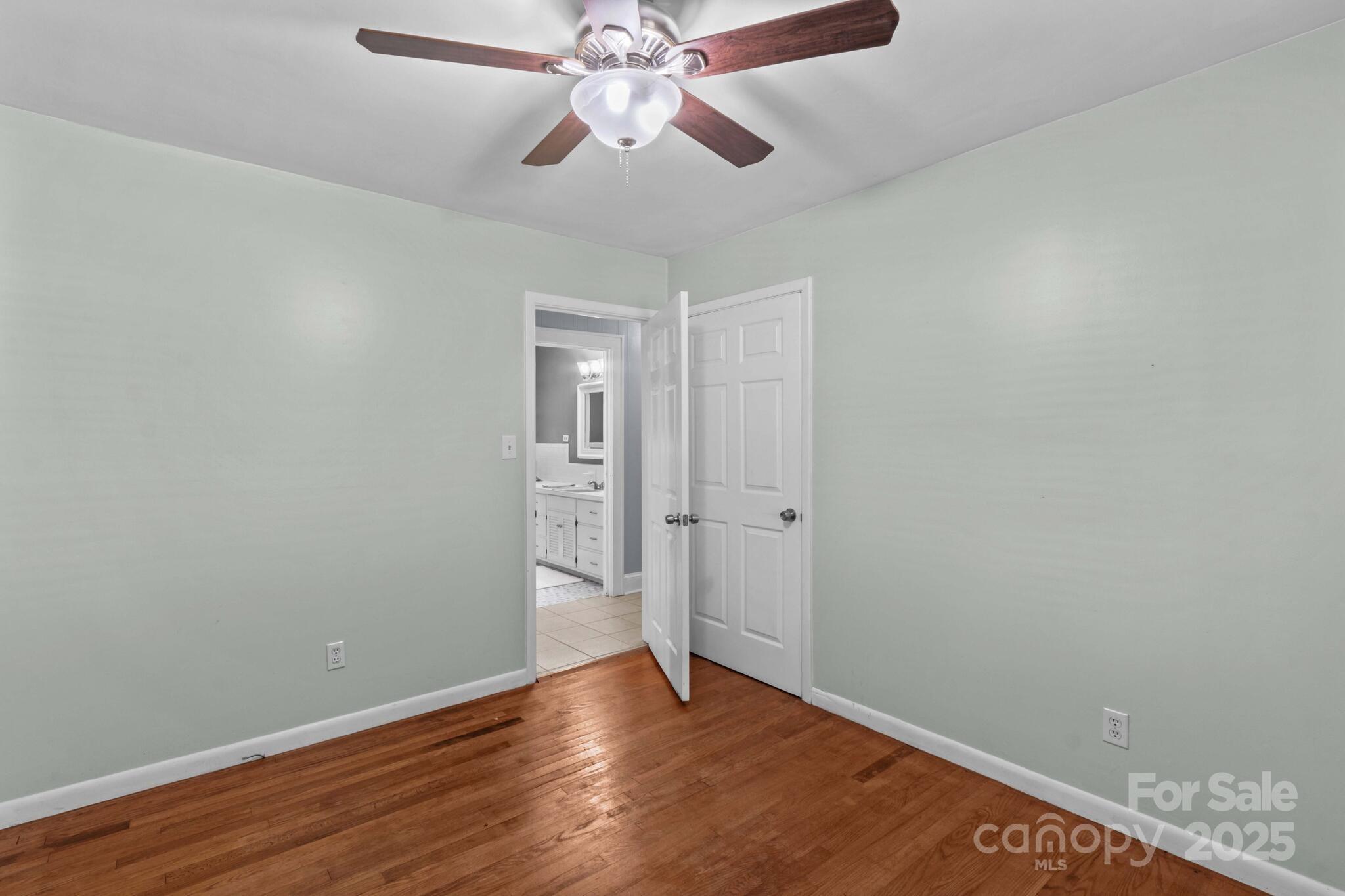 1231 Maxwell Street Salisbury, NC 28144 - Photo 24 of 42 an empty room with wooden floor closet and fan