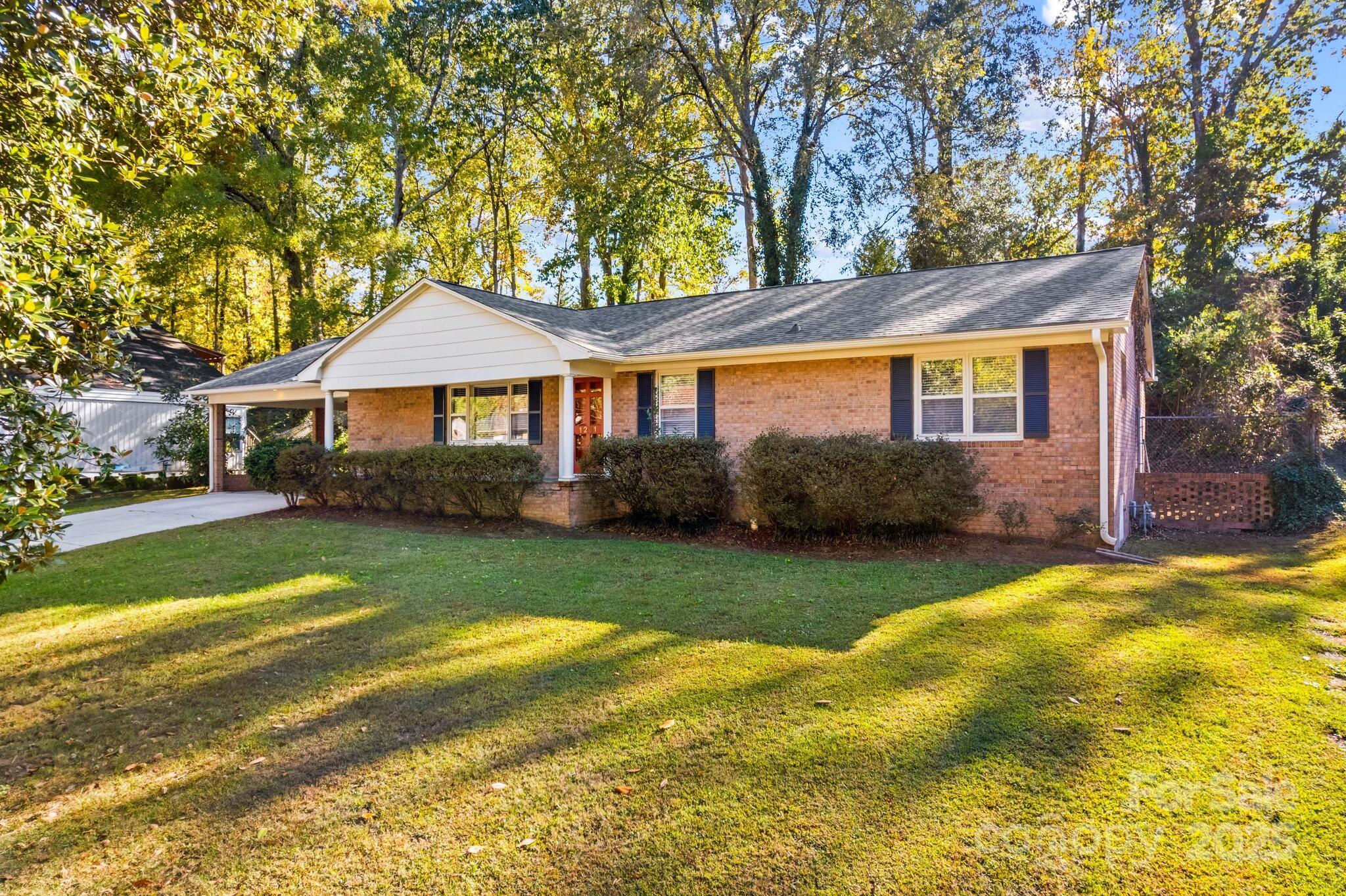 1231 Maxwell Street Salisbury, NC 28144 - Photo 3 of 42 a front view of a house with a yard