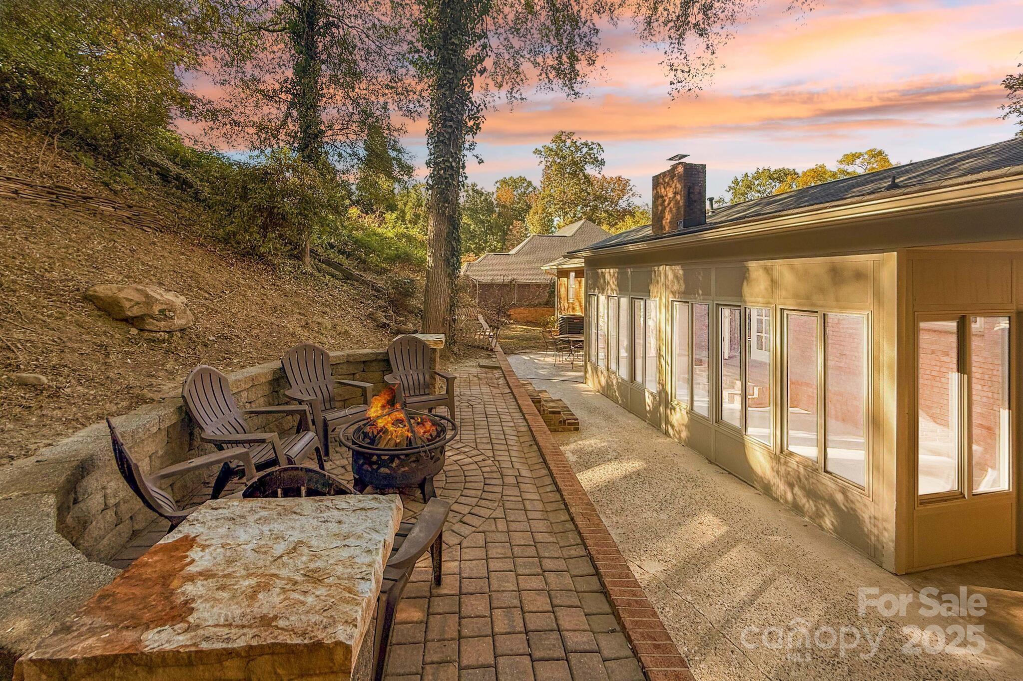 1231 Maxwell Street Salisbury, NC 28144 - Photo 35 of 42 a view of a patio with table and chairs with wooden floor and fence