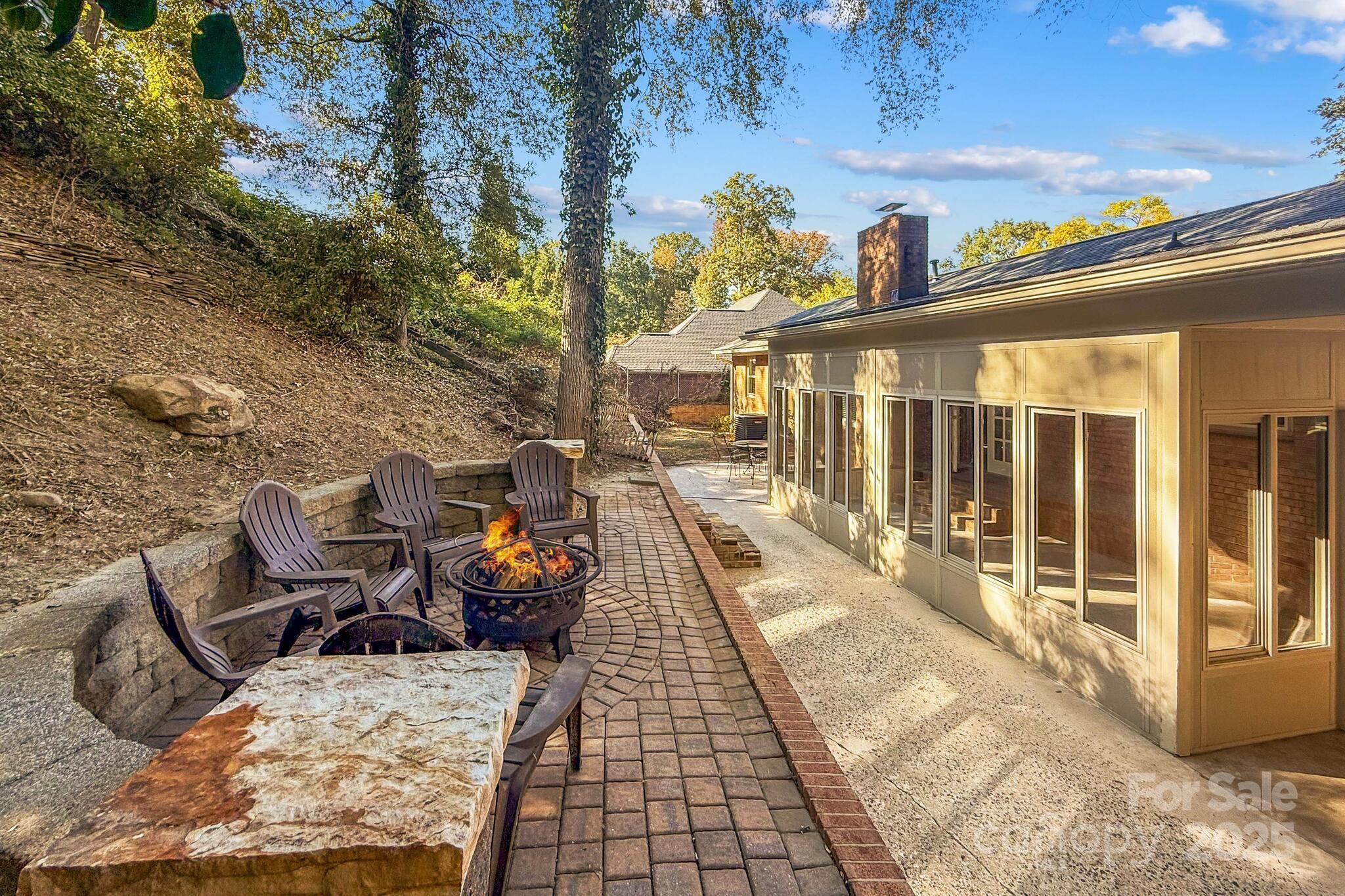 1231 Maxwell Street Salisbury, NC 28144 - Photo 36 of 42 a view of a patio with table and chairs with wooden floor and fence