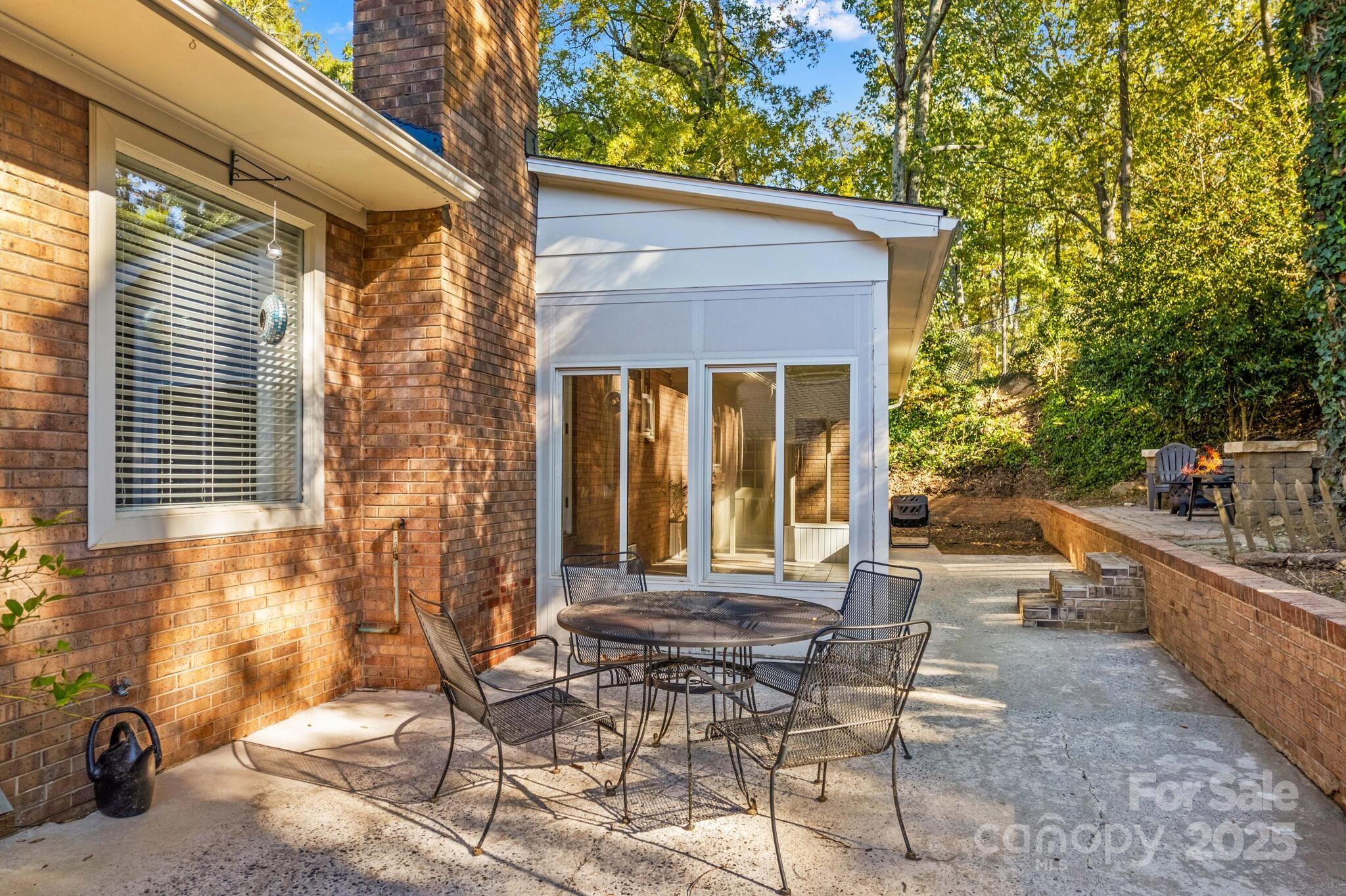 1231 Maxwell Street Salisbury, NC 28144 - Photo 41 of 42 a view of a chair and fire pit in the backyard of a house