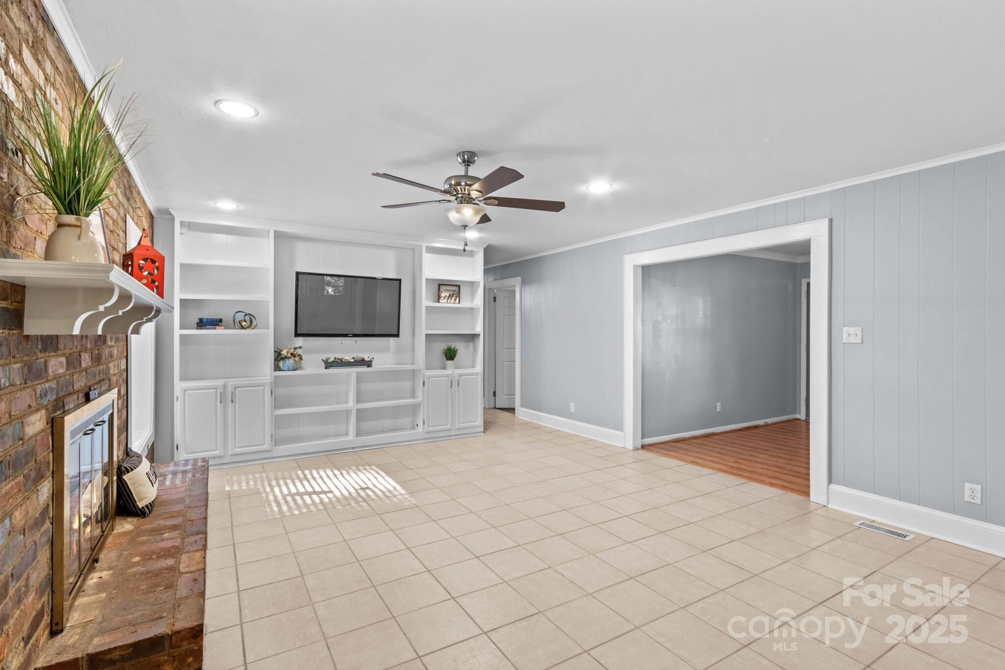 1231 Maxwell Street Salisbury, NC 28144 - Photo 10 of 42 a view of a livingroom with furniture and a flat screen tv