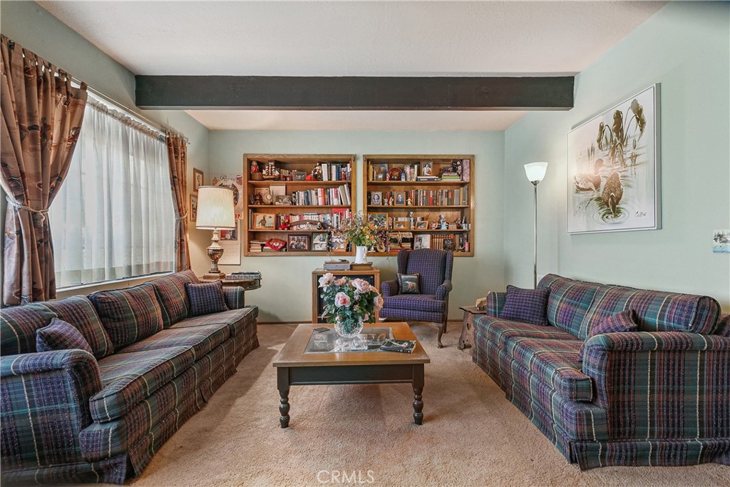 329 Grass Valley Road Lake Arrowhead, CA 92352 - Photo 9 of 31 a living room with furniture and a large window