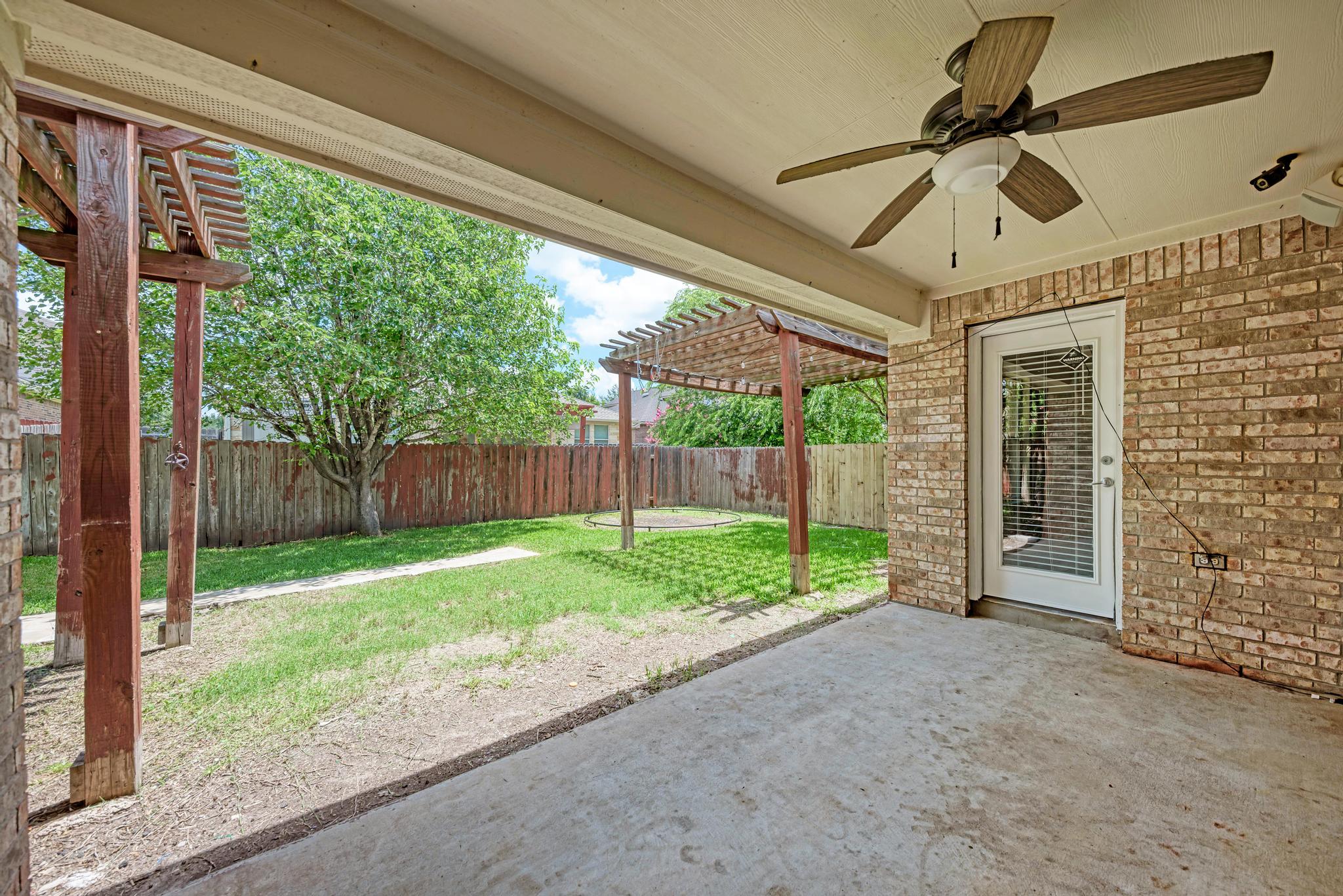 18308 Shallow Pool Drive Pflugerville, TX 78660 - Photo 30 of 40 Medium-sized covered patio with built-in speakers.