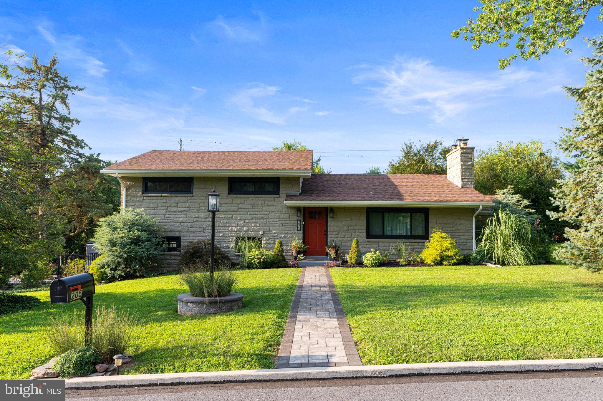 205 East Glenn Road Hershey, PA 17033 - Photo 1 of 52 a front view of a house with garden