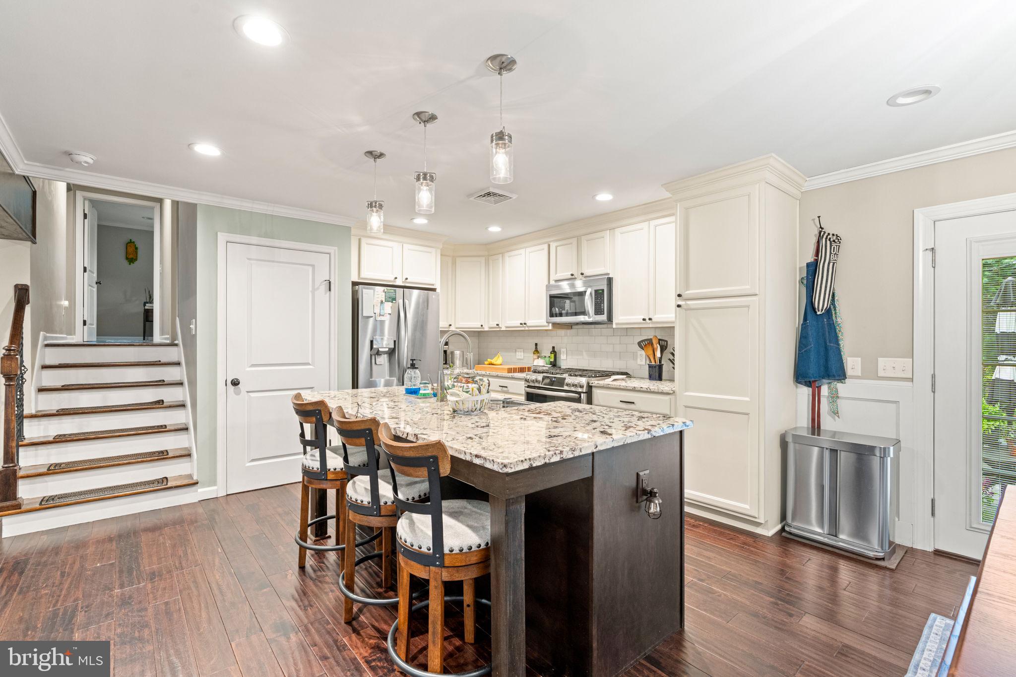 205 East Glenn Road Hershey, PA 17033 - Photo 11 of 52 a kitchen with stainless steel appliances granite countertop a dining table chairs refrigerator and cabinets