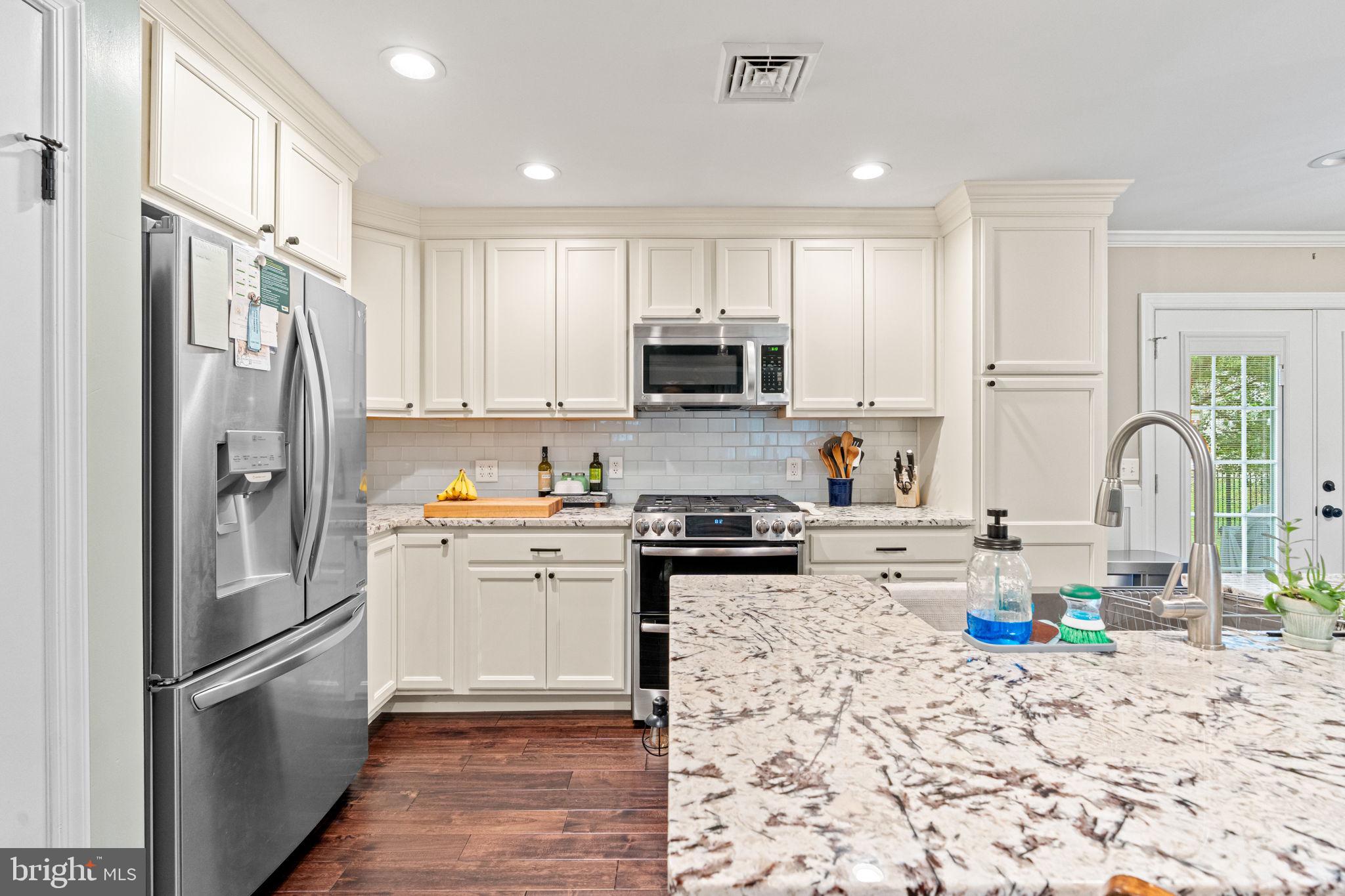 205 East Glenn Road Hershey, PA 17033 - Photo 12 of 52 a kitchen with stainless steel appliances granite countertop a refrigerator sink and stove