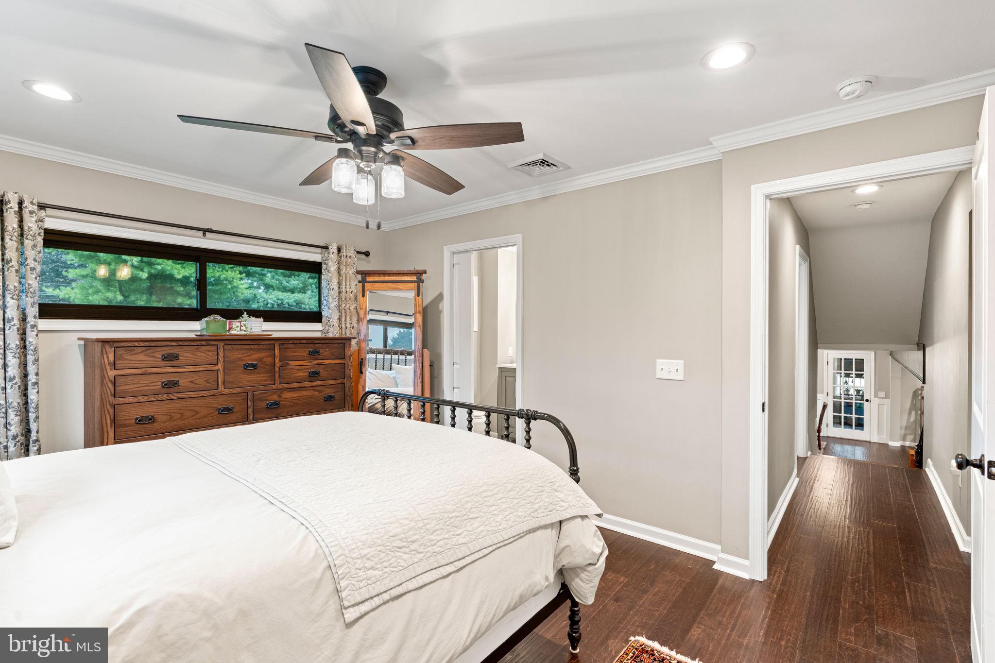 205 East Glenn Road Hershey, PA 17033 - Photo 24 of 52 a bedroom with a large bed and a chandelier