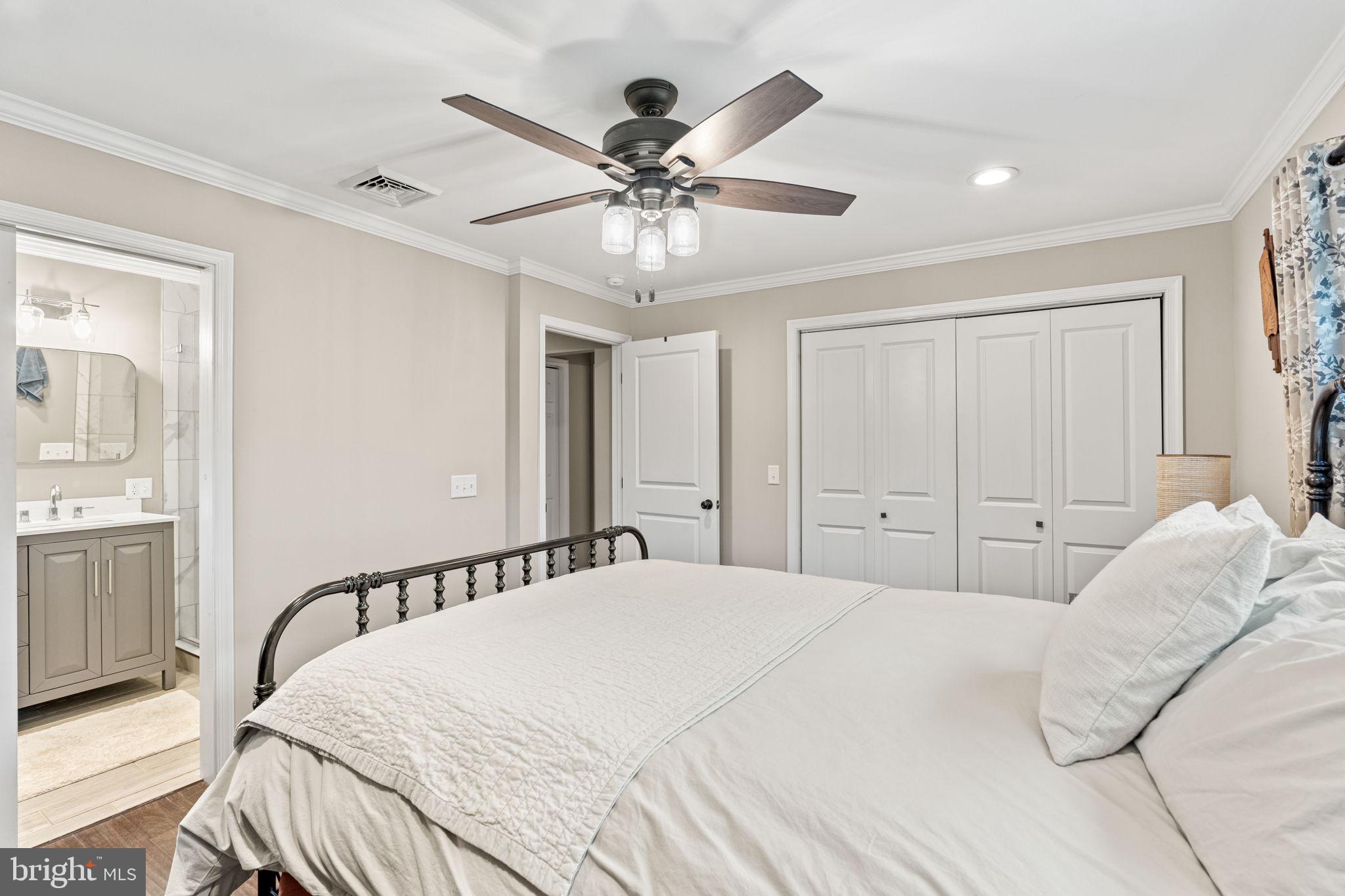 205 East Glenn Road Hershey, PA 17033 - Photo 25 of 52 a bedroom with a large bed and a chandelier
