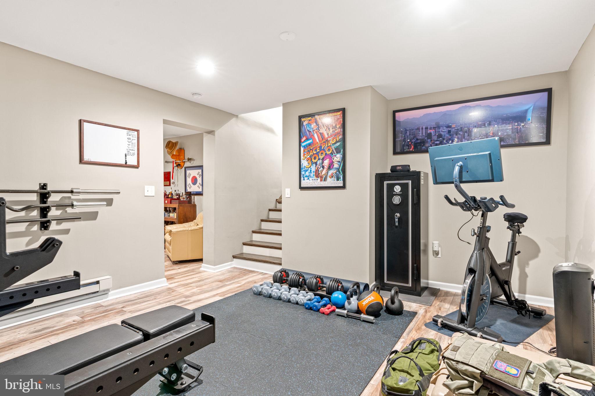 205 East Glenn Road Hershey, PA 17033 - Photo 35 of 52 a room with gym equipment and a flat screen tv