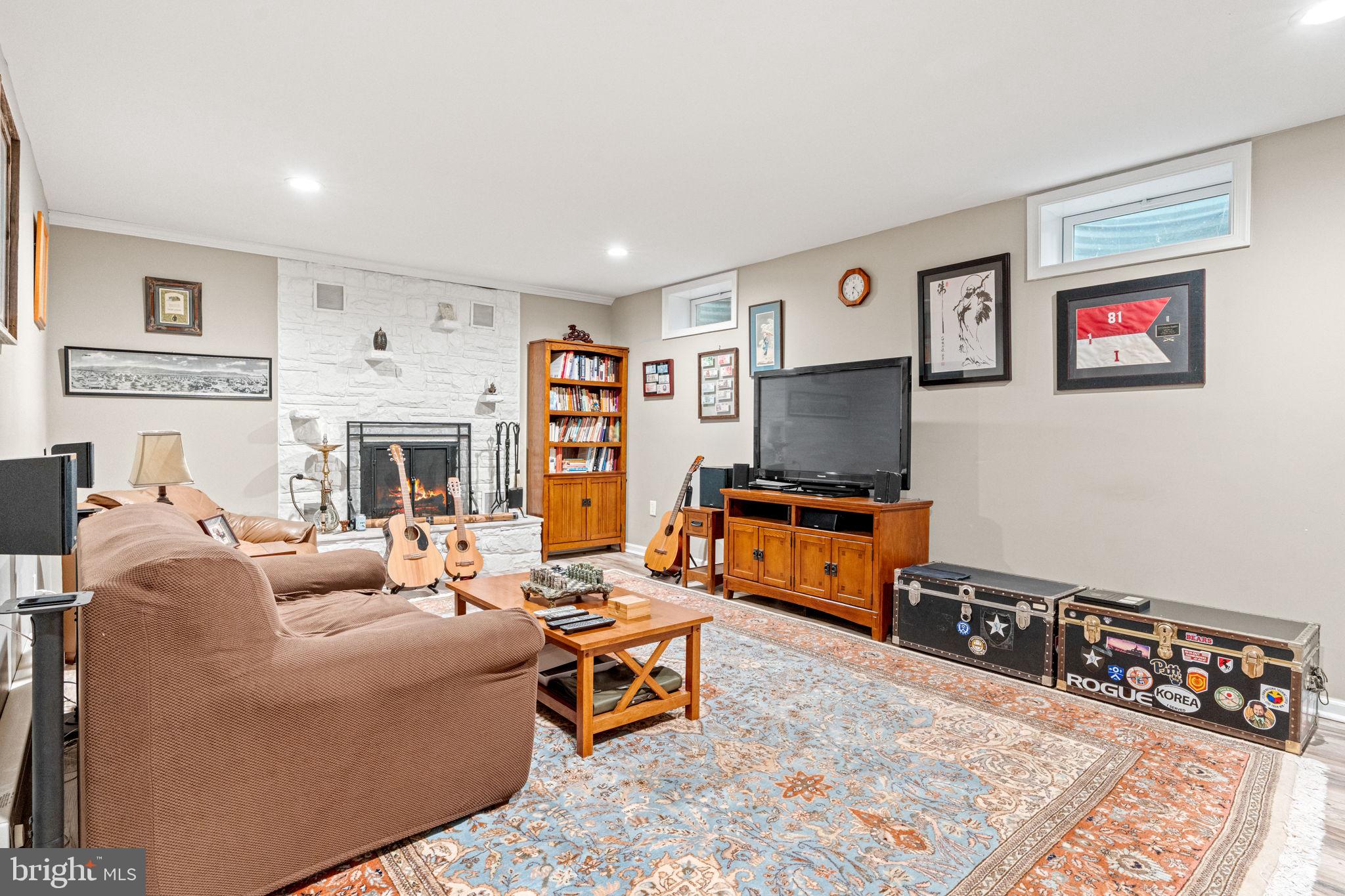 205 East Glenn Road Hershey, PA 17033 - Photo 36 of 52 a living room with fireplace furniture and a flat screen tv