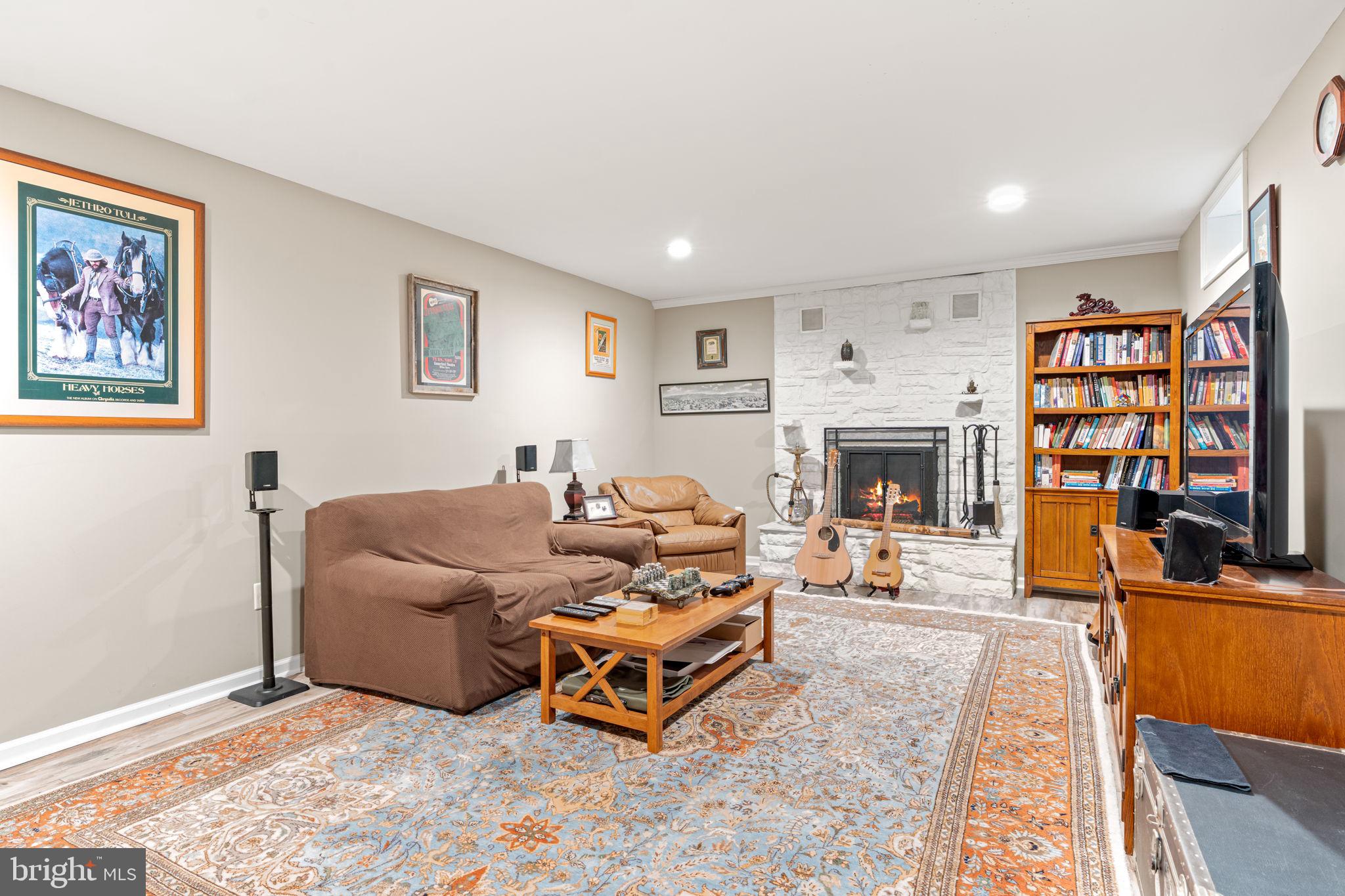 205 East Glenn Road Hershey, PA 17033 - Photo 37 of 52 a living room with furniture flat screen tv and a fireplace