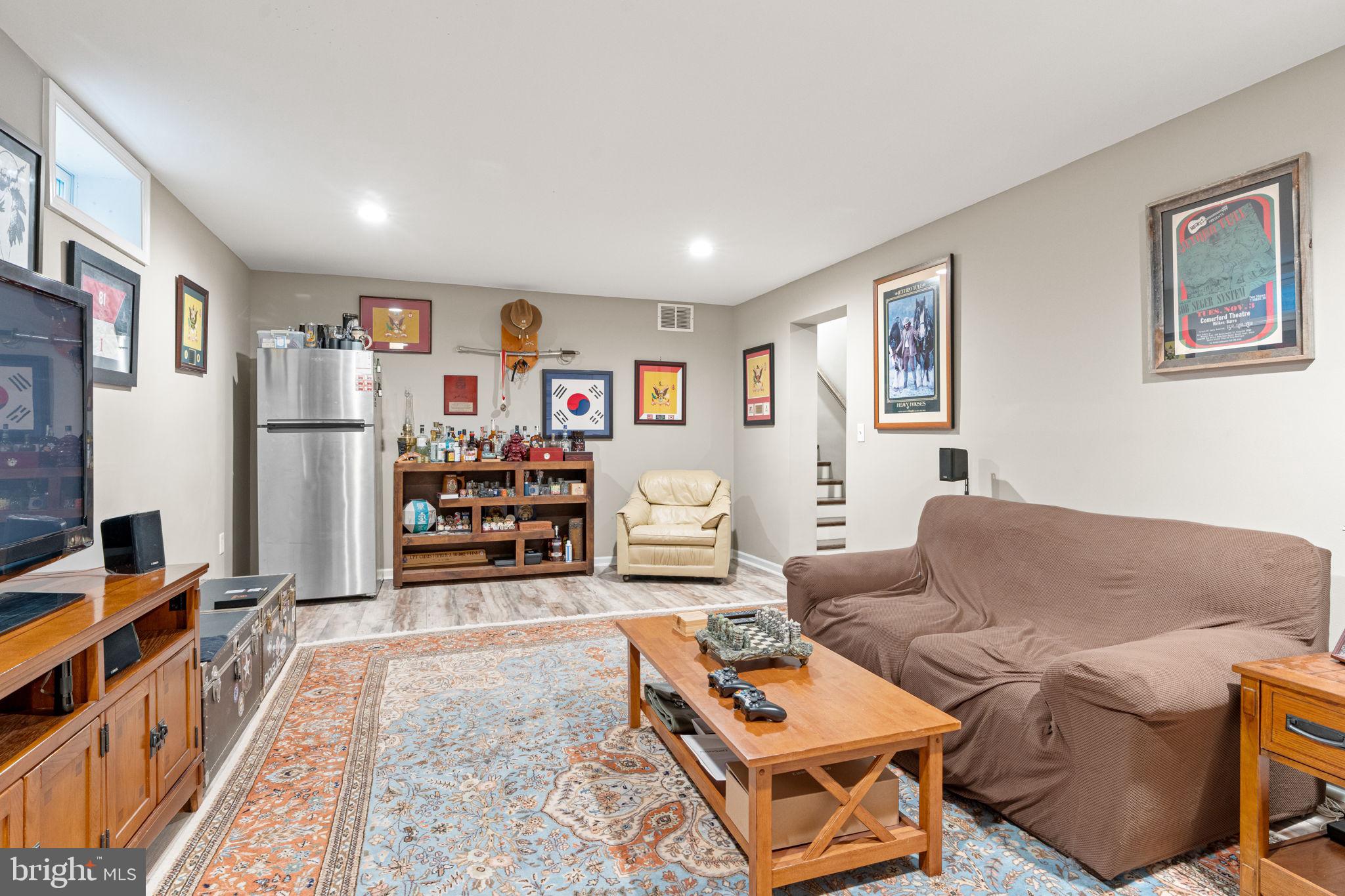 205 East Glenn Road Hershey, PA 17033 - Photo 38 of 52 a living room with furniture and a flat screen tv