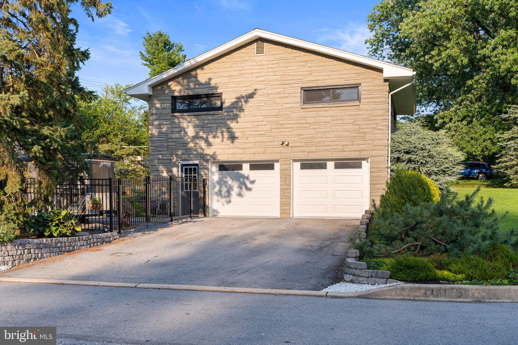 205 East Glenn Road Hershey, PA 17033 - Photo 40 of 52 a front view of house with yard and trees around