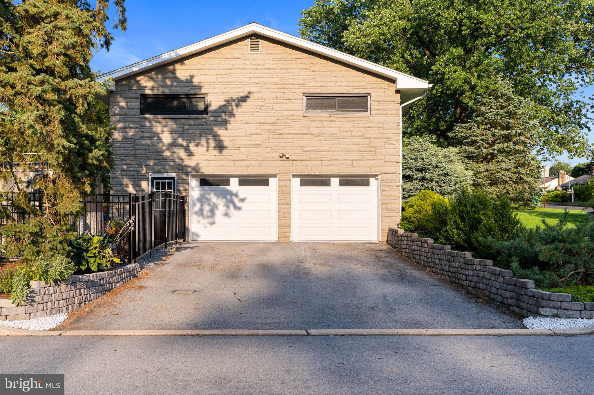 205 East Glenn Road Hershey, PA 17033 - Photo 41 of 52 a front view of a house with a yard and garage