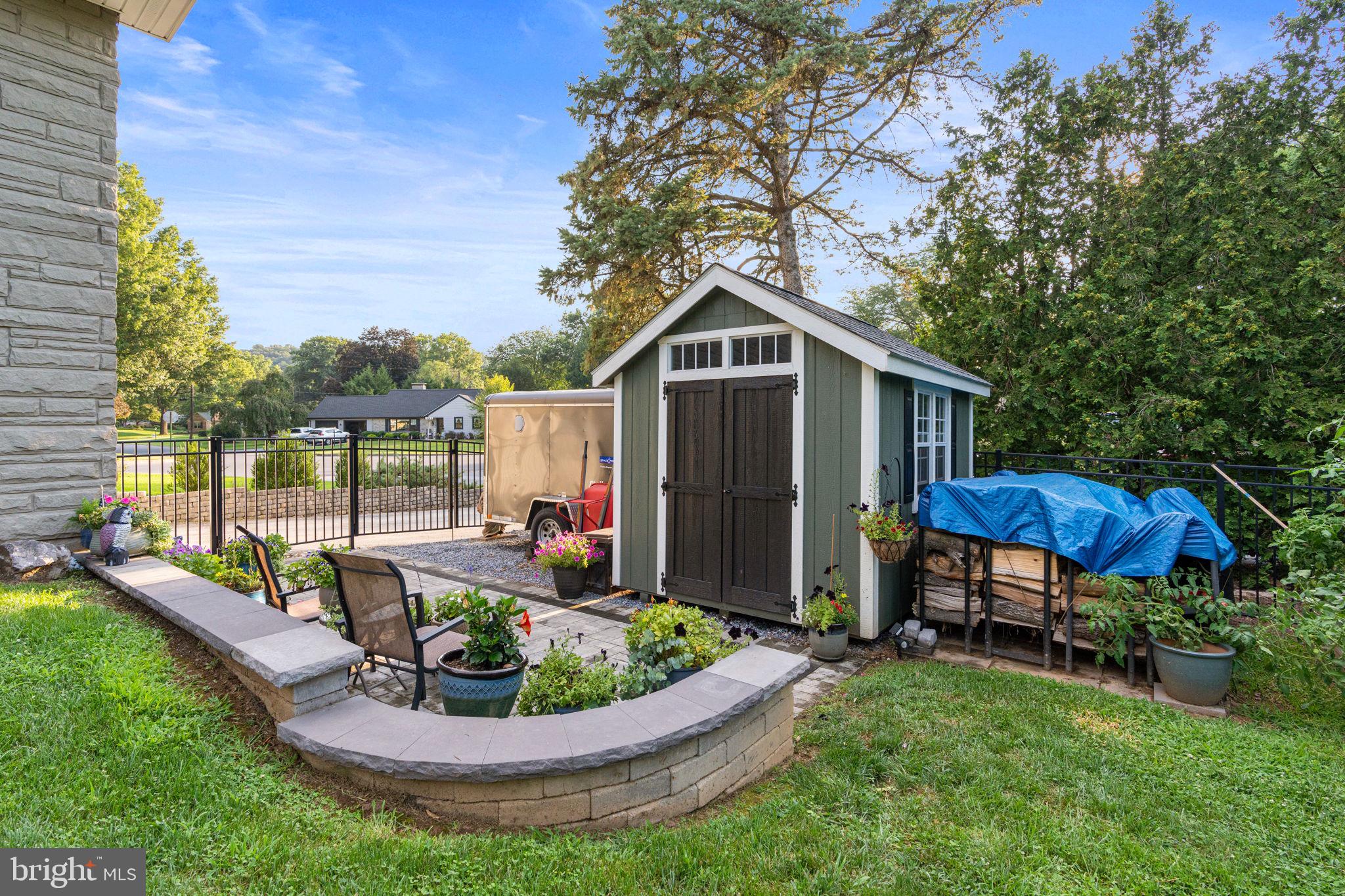 205 East Glenn Road Hershey, PA 17033 - Photo 43 of 52 a view of a house with a yard fire pit and chairs