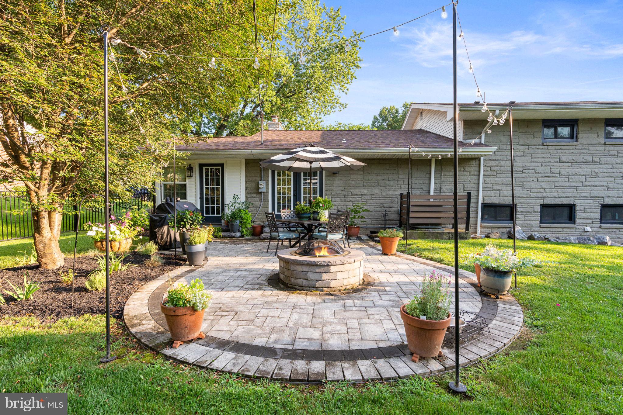 205 East Glenn Road Hershey, PA 17033 - Photo 48 of 52 a view of a house with backyard sitting area and swimming pool