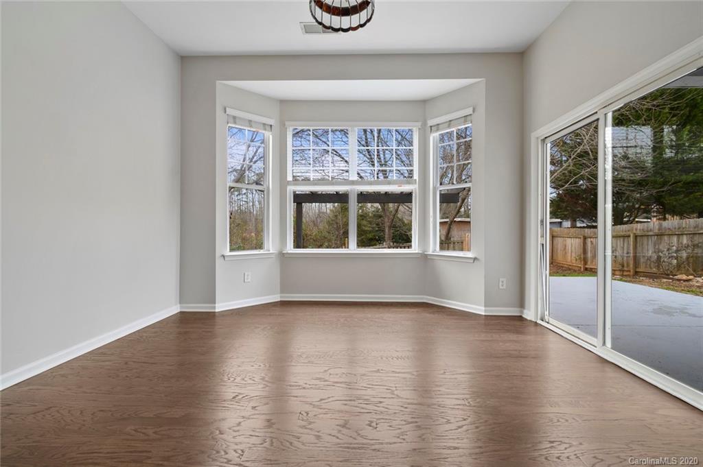 268 Sand Paver Way Fort Mill, SC 29708 - Photo 11 of 23 a view of an empty room with wooden floor and a window