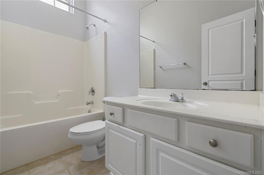 268 Sand Paver Way Fort Mill, SC 29708 - Photo 20 of 23 a bathroom with a toilet a sink a mirror a bathtub and vanity