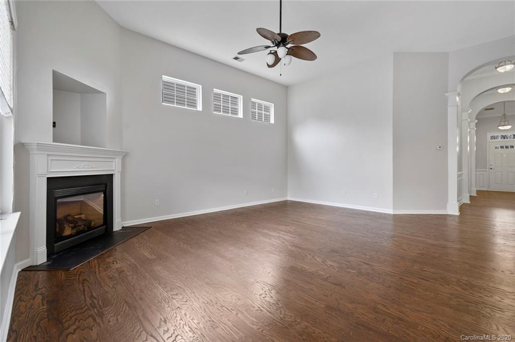 268 Sand Paver Way Fort Mill, SC 29708 - Photo 10 of 23 a view of empty room with wooden floor and fireplace