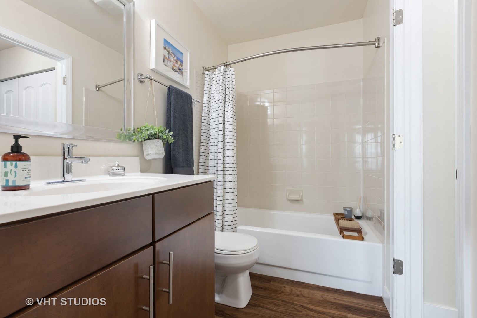 26 Sterling Circle, Unit 307 Wheaton, IL 60189 - Photo 23 of 40 a bathroom with a bathtub shower sink vanity and toilet