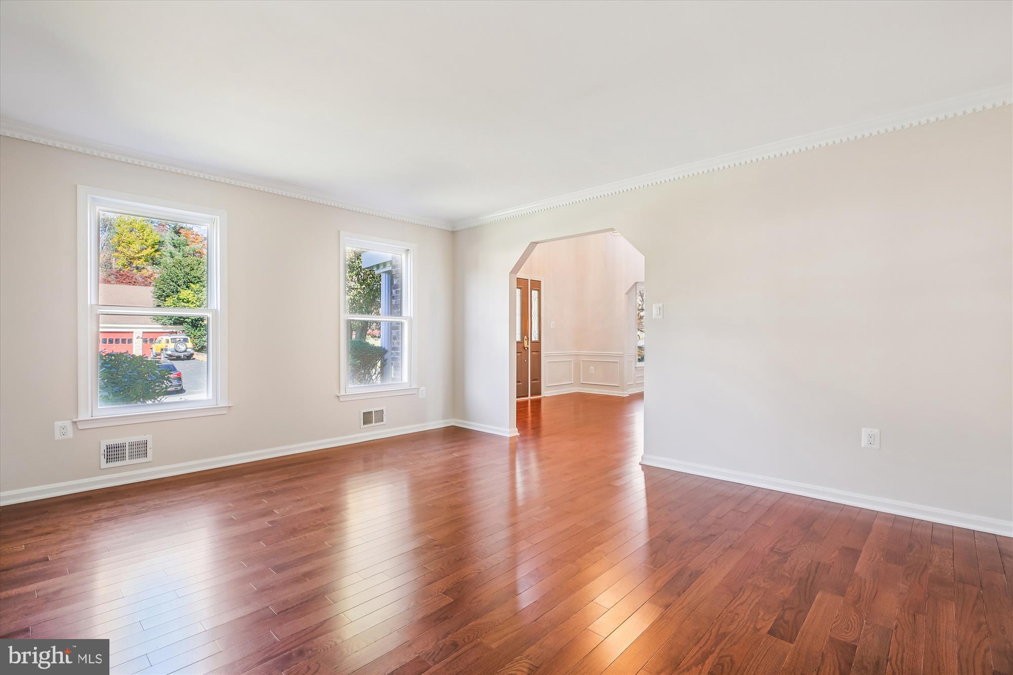 17 Locustwood Court Silver Spring, MD 20905 - Photo 11 of 72 a view of an empty room with wooden floor and a window