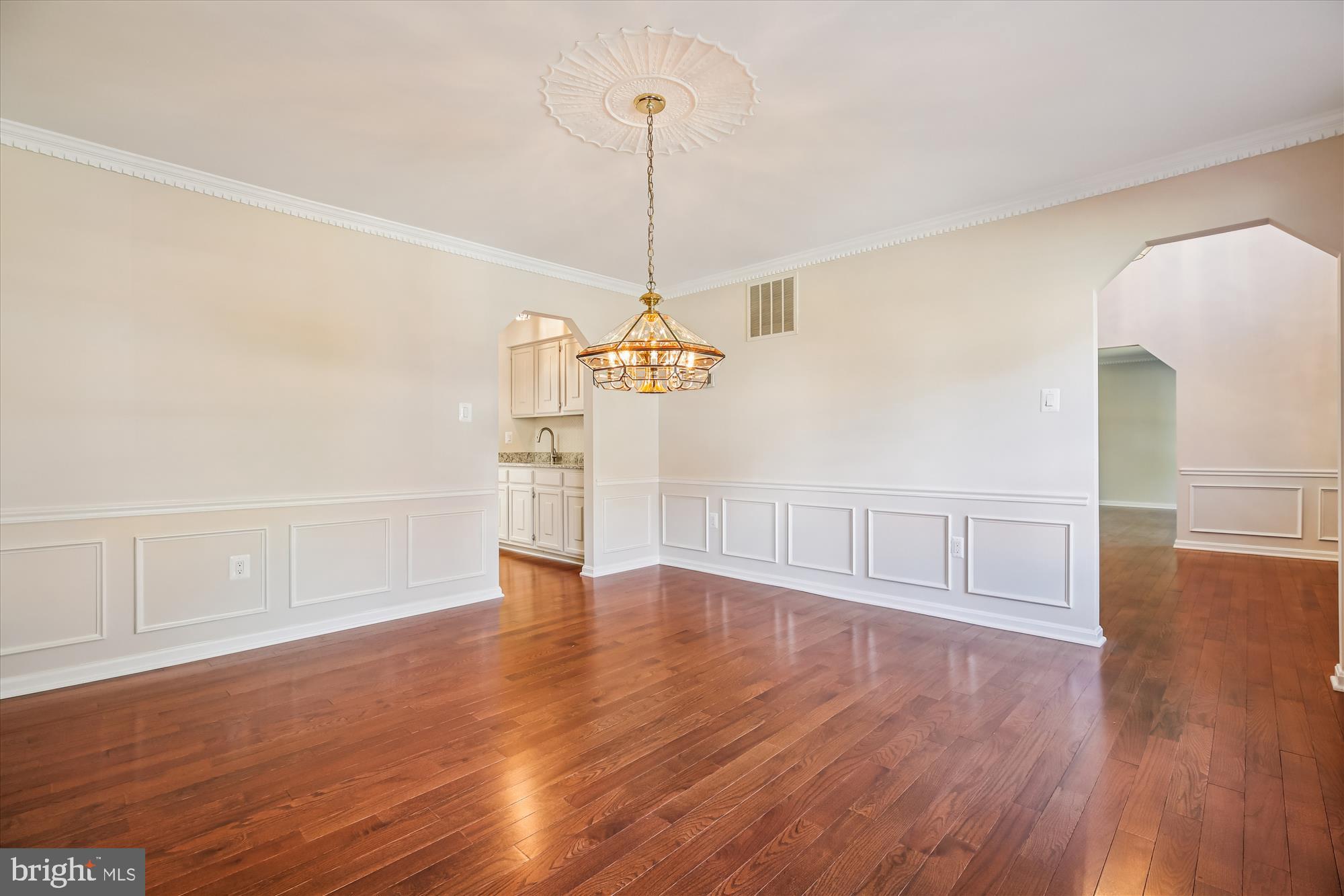17 Locustwood Court Silver Spring, MD 20905 - Photo 13 of 72 a view of a room with wooden floor ceiling fan and windows