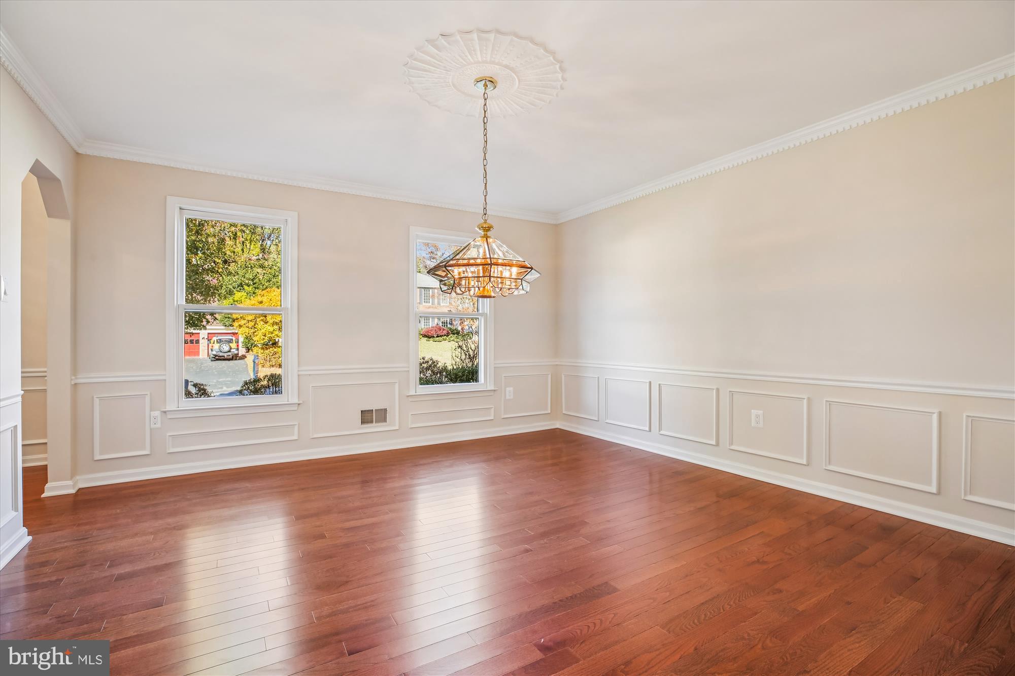 17 Locustwood Court Silver Spring, MD 20905 - Photo 14 of 72 a view of an empty room with window and wooden floor
