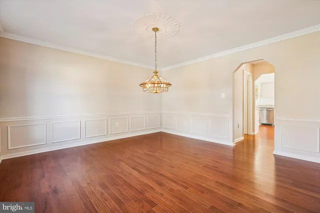 a view of an empty room and entryway