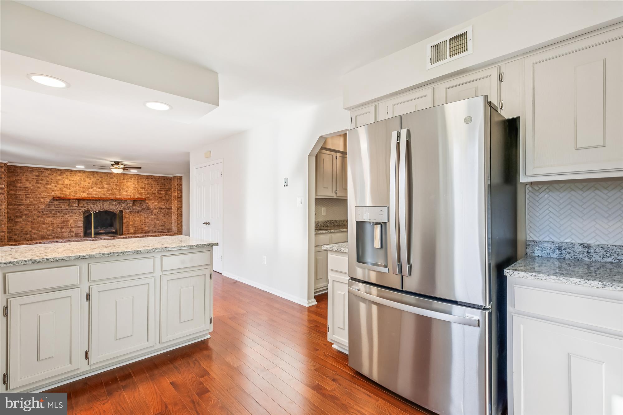 17 Locustwood Court Silver Spring, MD 20905 - Photo 22 of 72 a kitchen with stainless steel appliances a refrigerator and a stove top oven