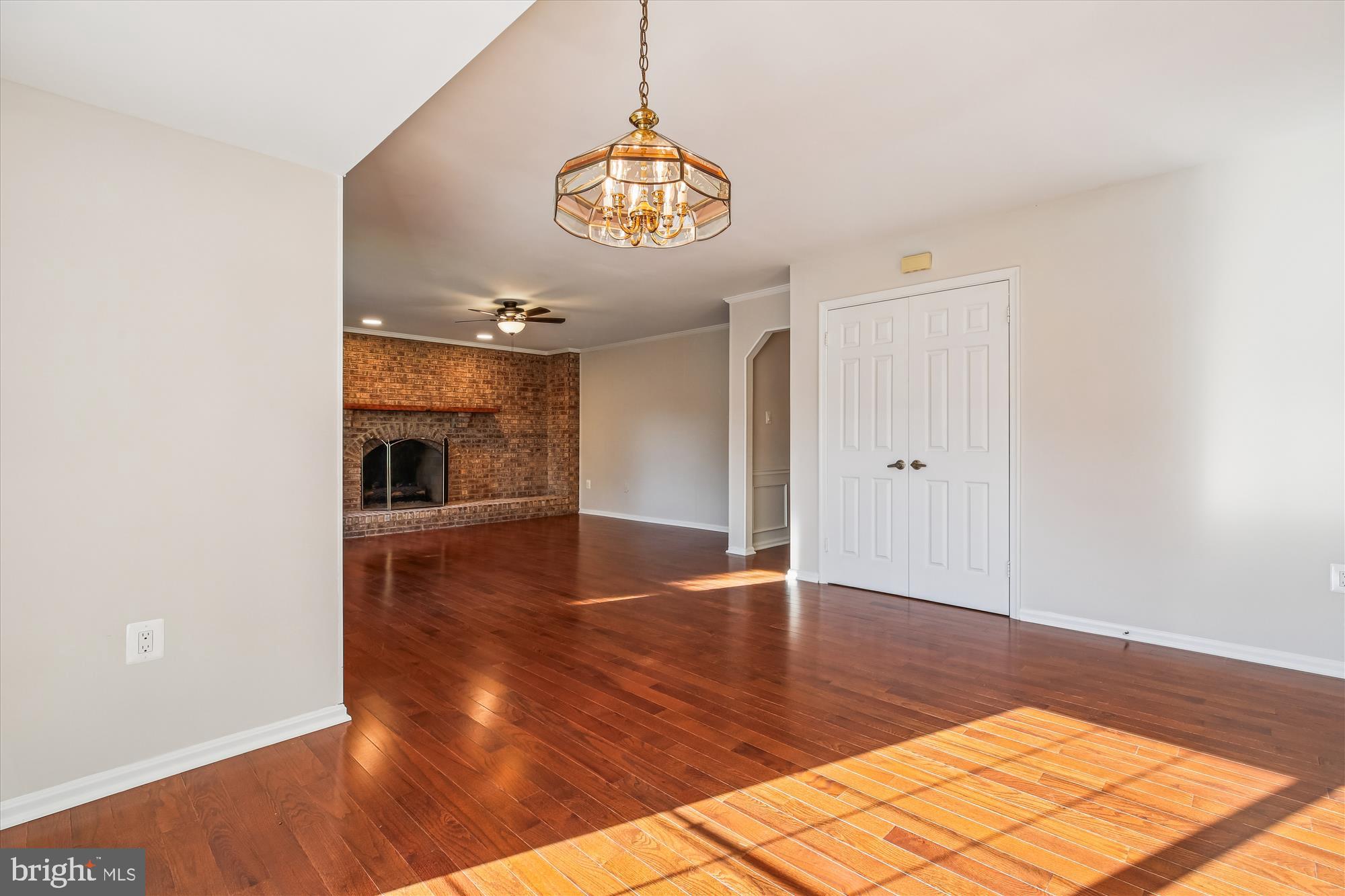17 Locustwood Court Silver Spring, MD 20905 - Photo 26 of 72 a view of an empty room with window and wooden floor