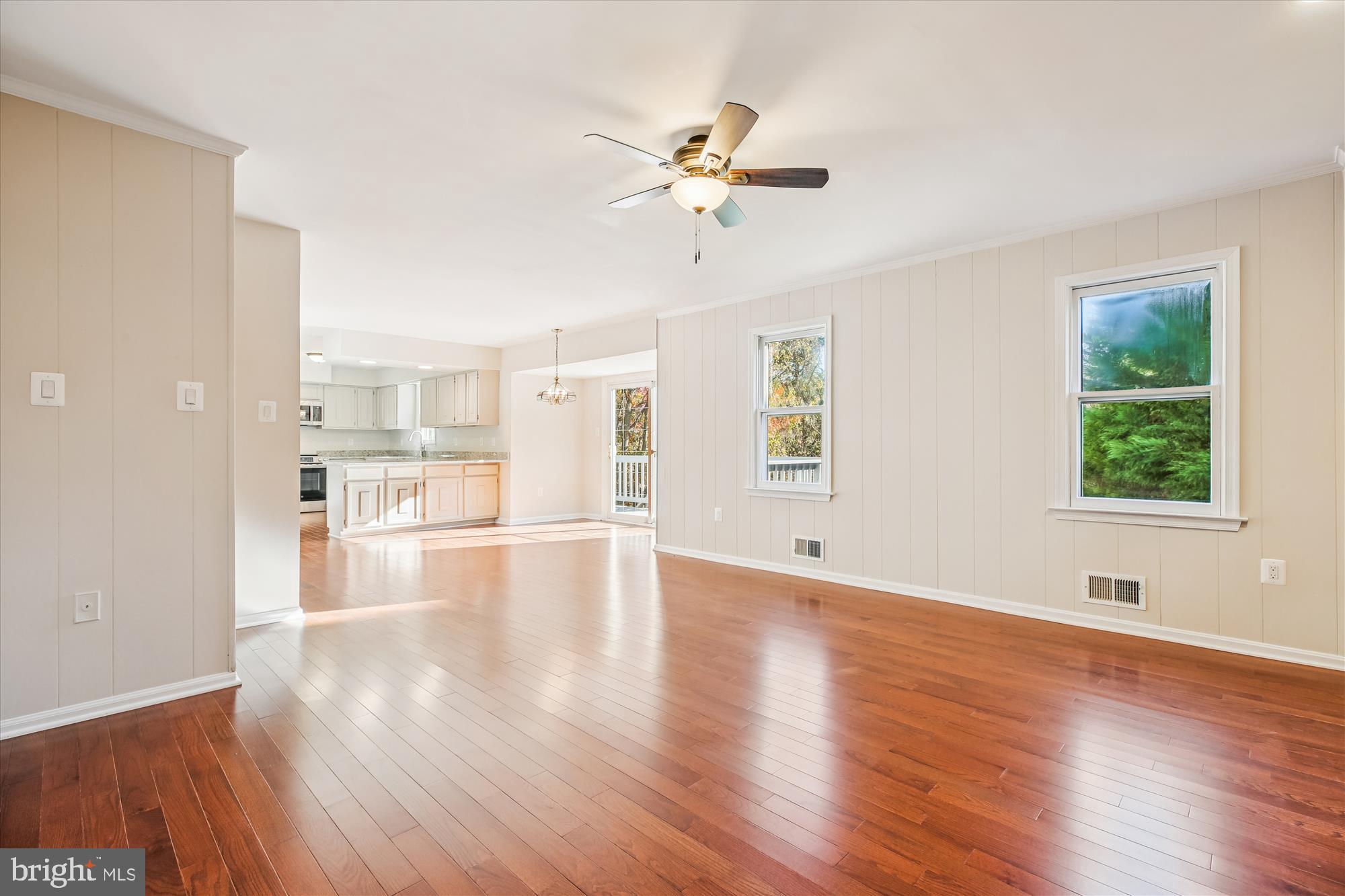 17 Locustwood Court Silver Spring, MD 20905 - Photo 30 of 72 a view of an empty room with wooden floor and a window