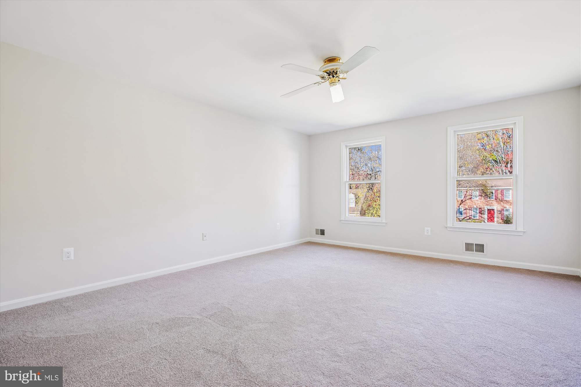 17 Locustwood Court Silver Spring, MD 20905 - Photo 34 of 72 an empty room with windows and fan
