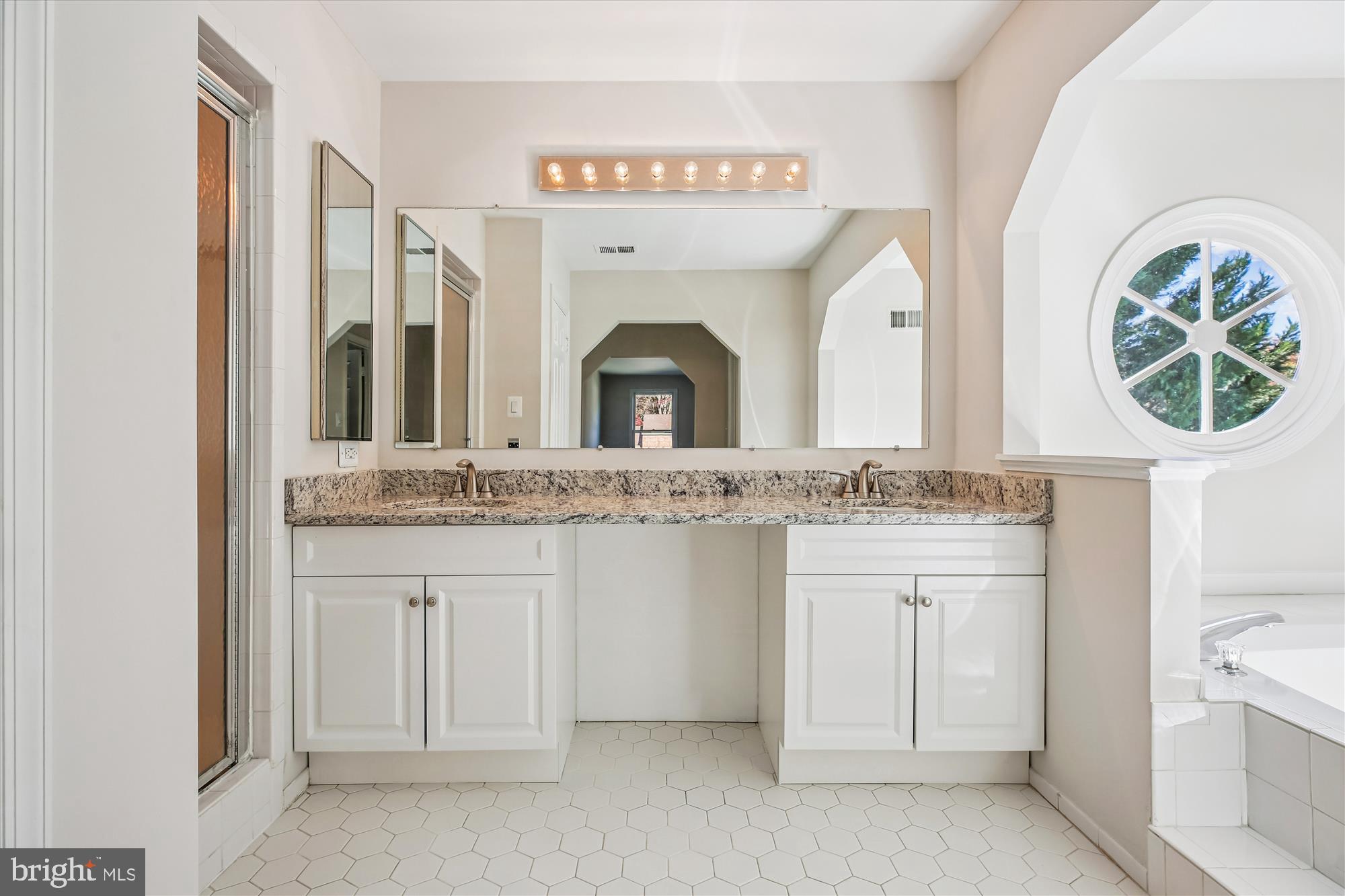 17 Locustwood Court Silver Spring, MD 20905 - Photo 38 of 72 a bathroom with a granite countertop sink and a mirror