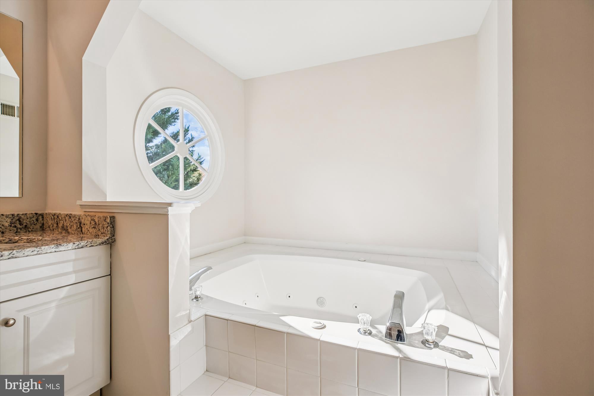 17 Locustwood Court Silver Spring, MD 20905 - Photo 40 of 72 a bathroom with a granite countertop sink and a bathtub