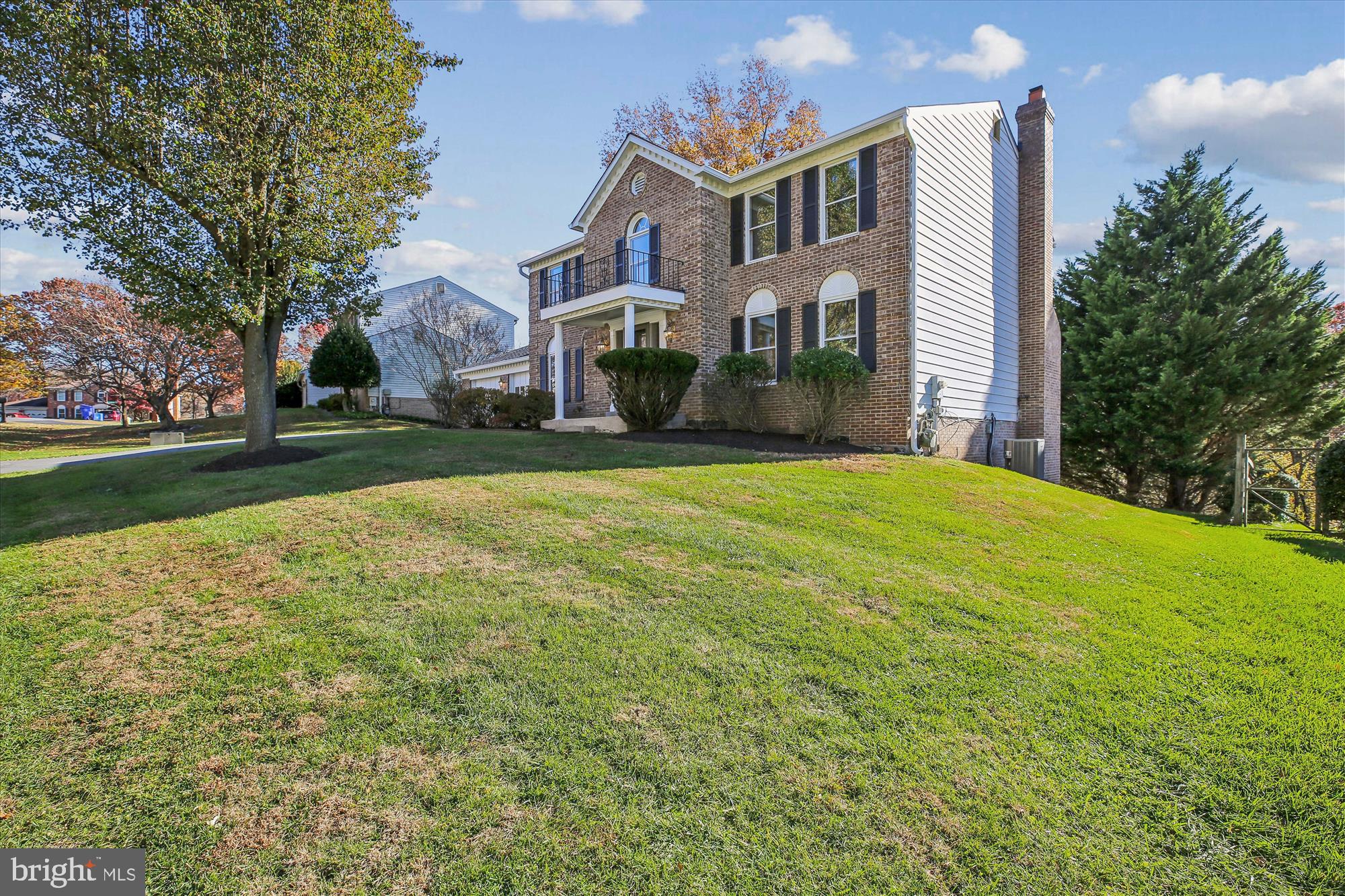 17 Locustwood Court Silver Spring, MD 20905 - Photo 4 of 72 a view of a big house with a big yard and large trees