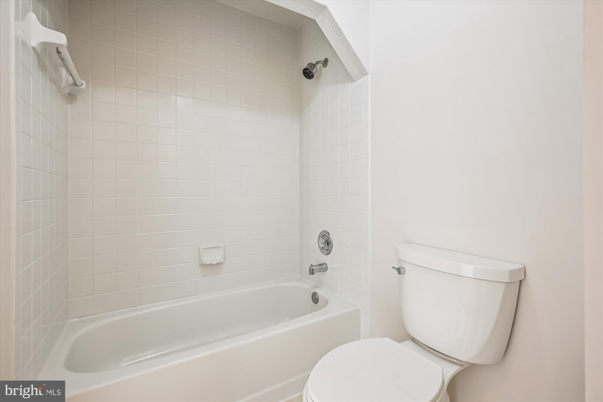 17 Locustwood Court Silver Spring, MD 20905 - Photo 55 of 72 a white toilet sitting next to a bath tub